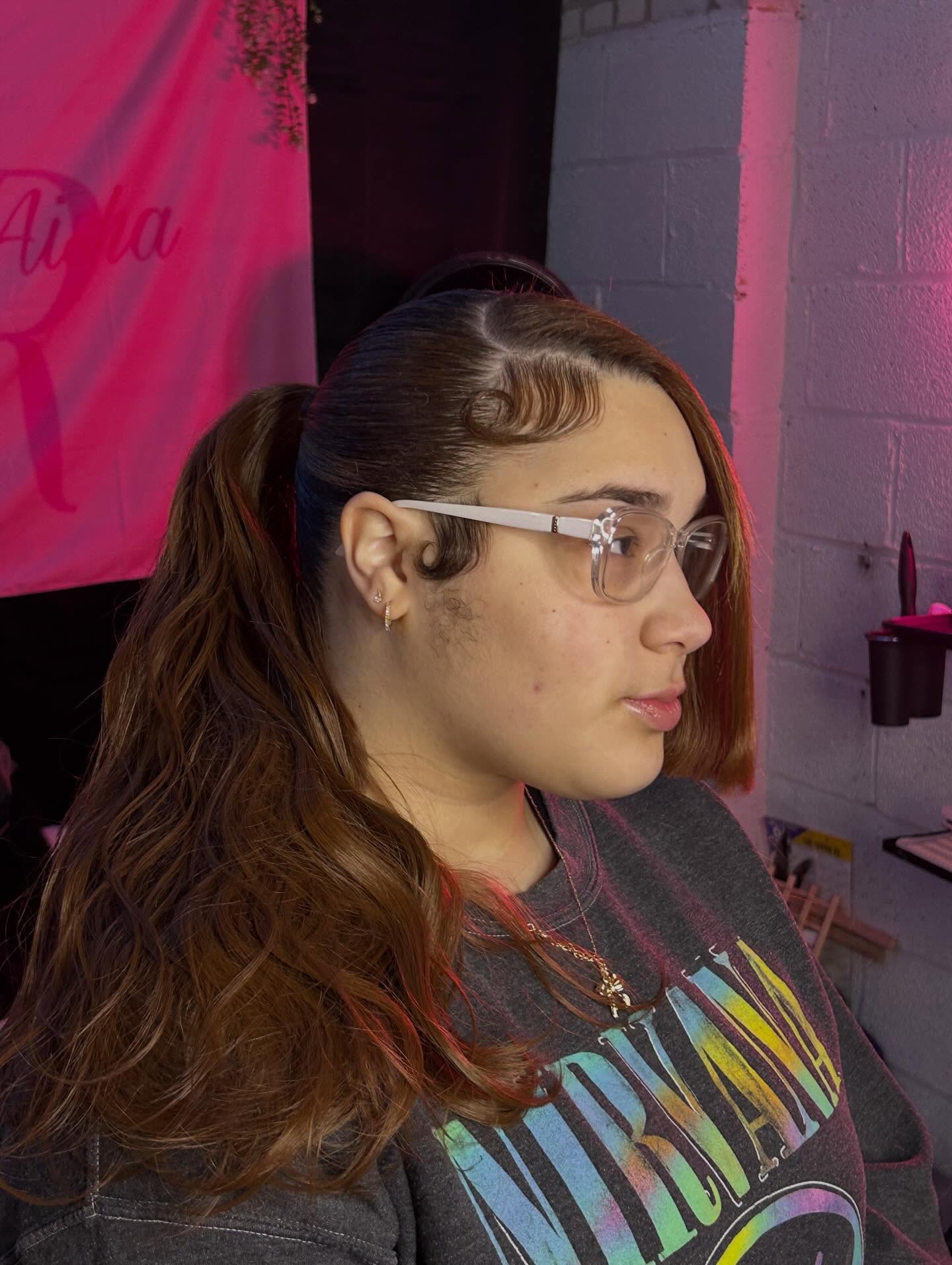 Sleek Side-Swept Ponytail with Sculpted Baby Hairs