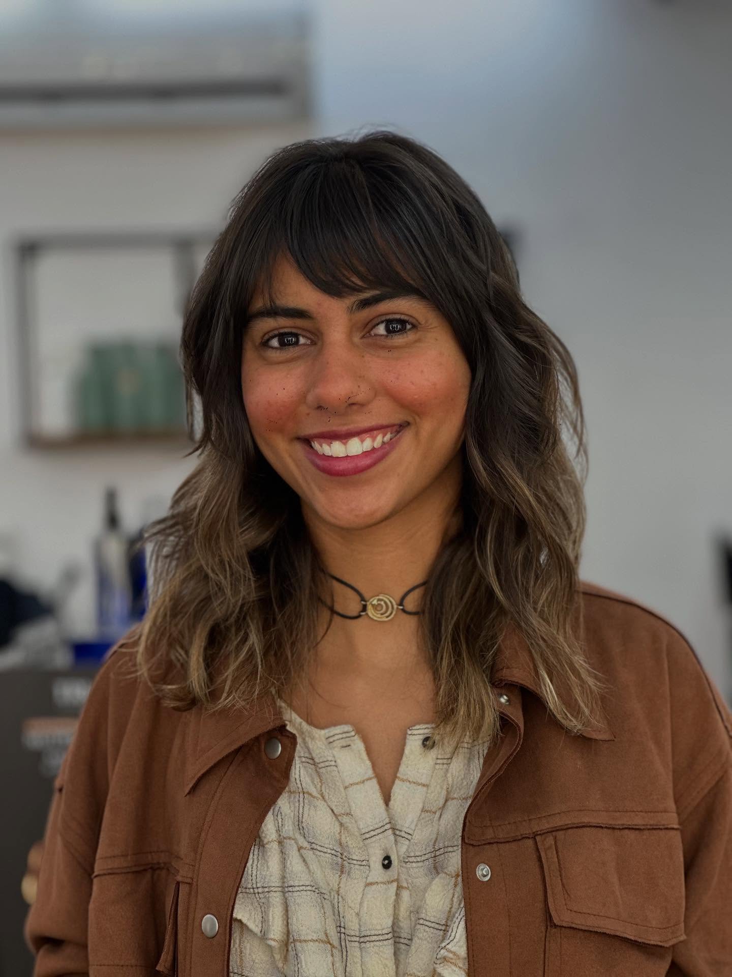 Soft Shaggy Shoulder-Length Cut with Rounded Wispy Fringe
