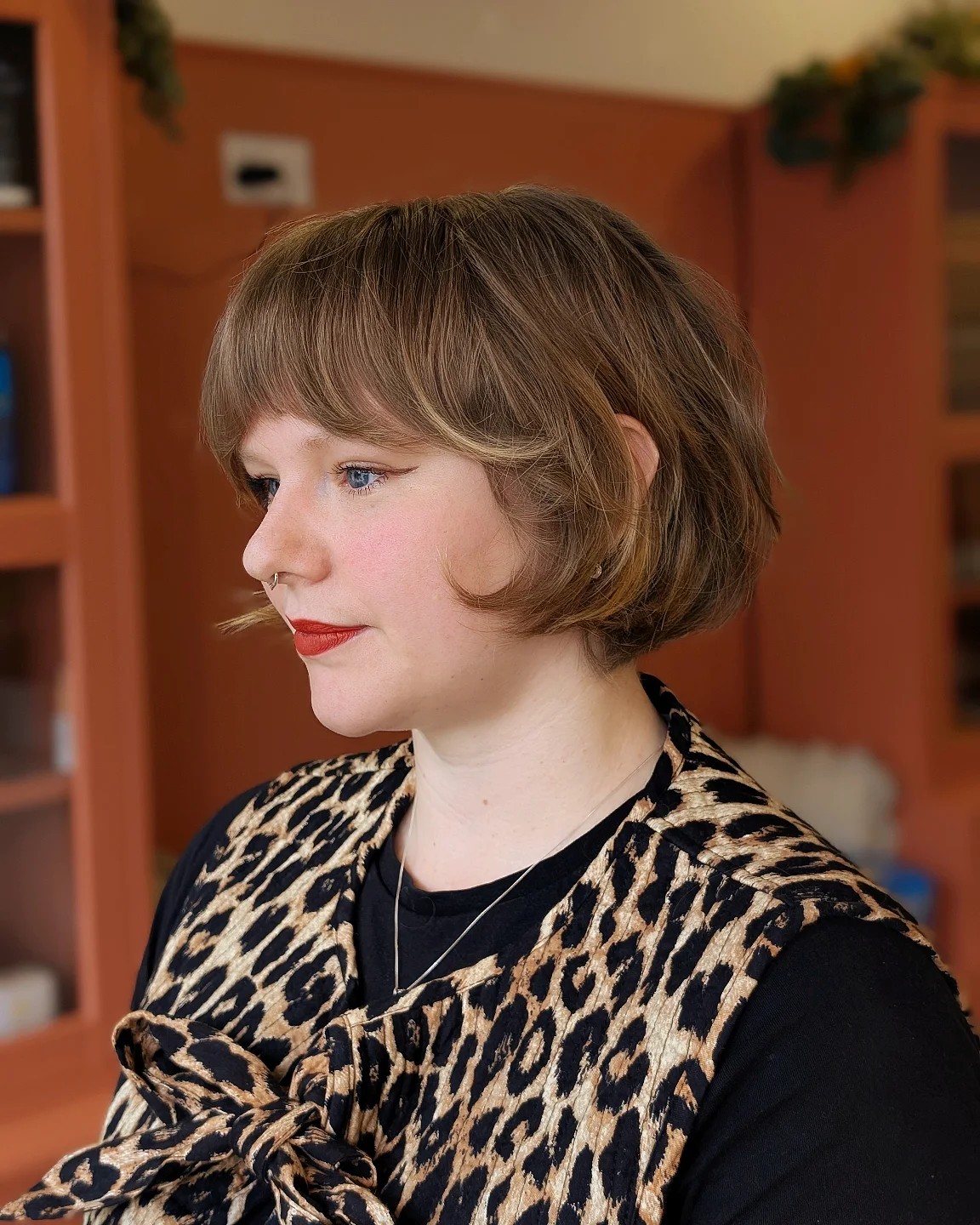 Textured Chin-Length Rounded Bob with Blunt Micro-Bang and Subtle Caramel Face-Framing