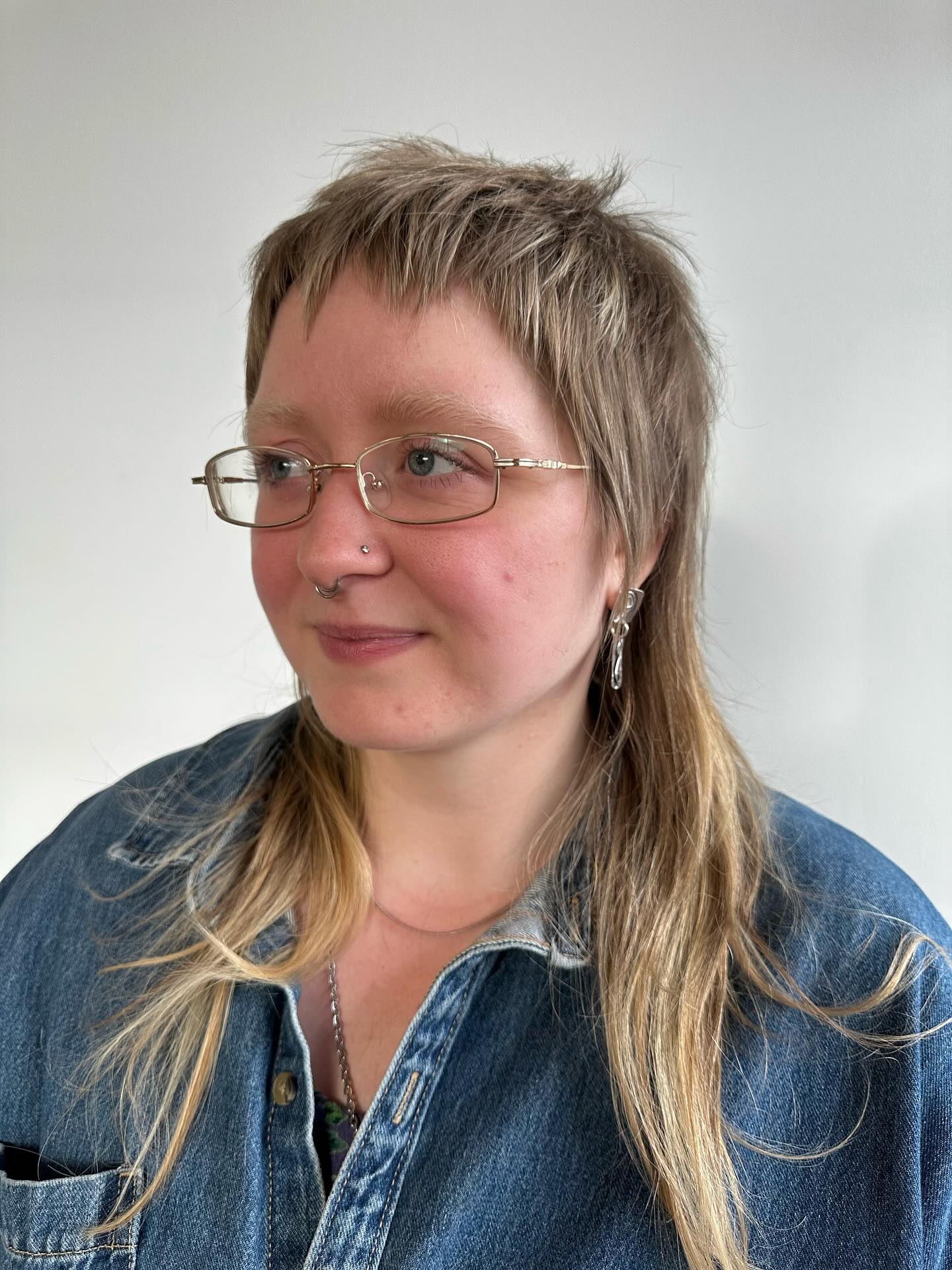 Textured Short Mullet with Jagged Micro Bangs and Ash-Blonde Layers