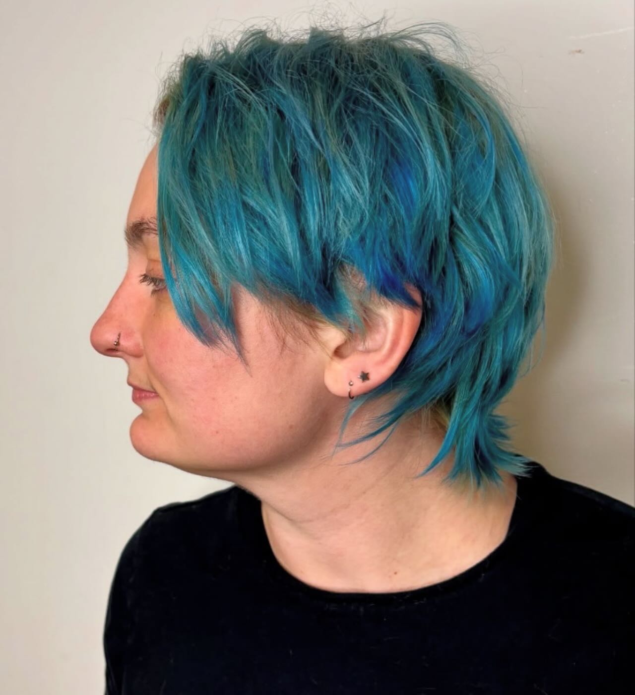 Textured Teal Choppy Shag with Wispy Nape and Side-Swept Fringe