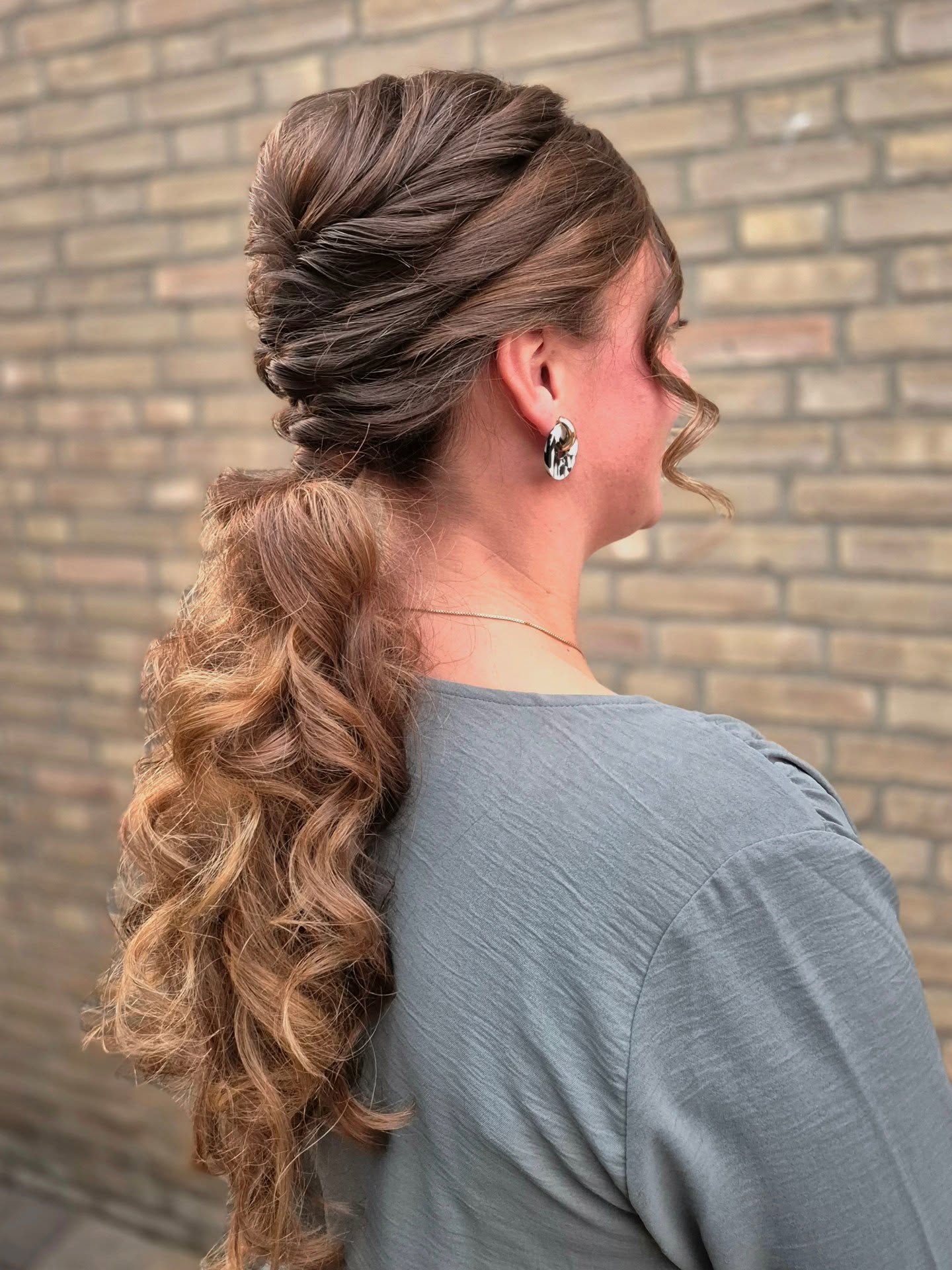 Twisted Stacked Low Pony with Textured Cascading Curls