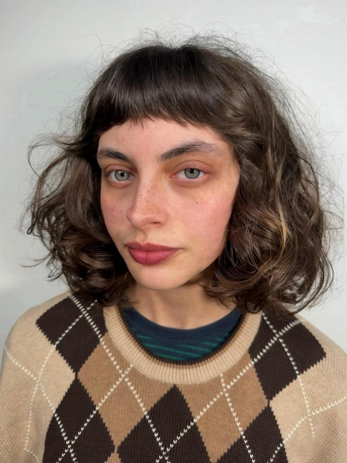 Voluminous Curly Bob with Cropped Micro Bangs