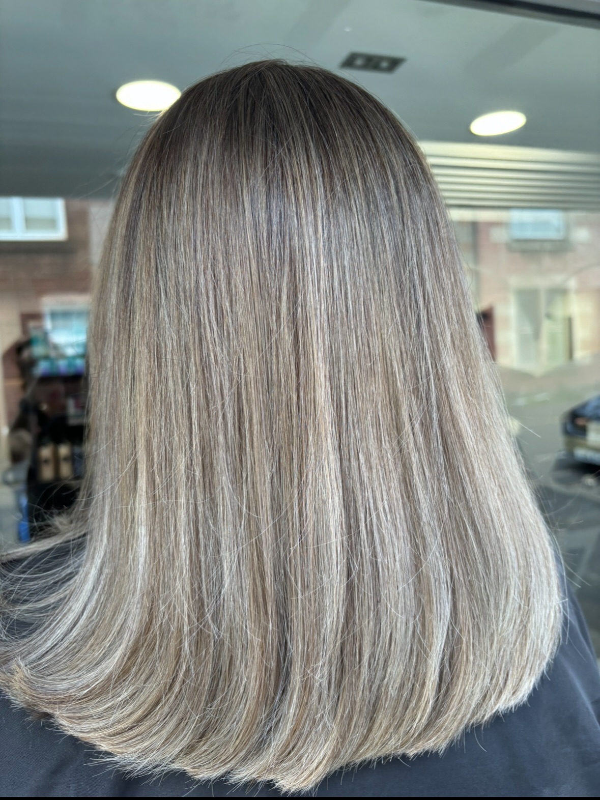 Ash-Rooted Bronde Mid-Length Blunt with Subtle Interior Layers