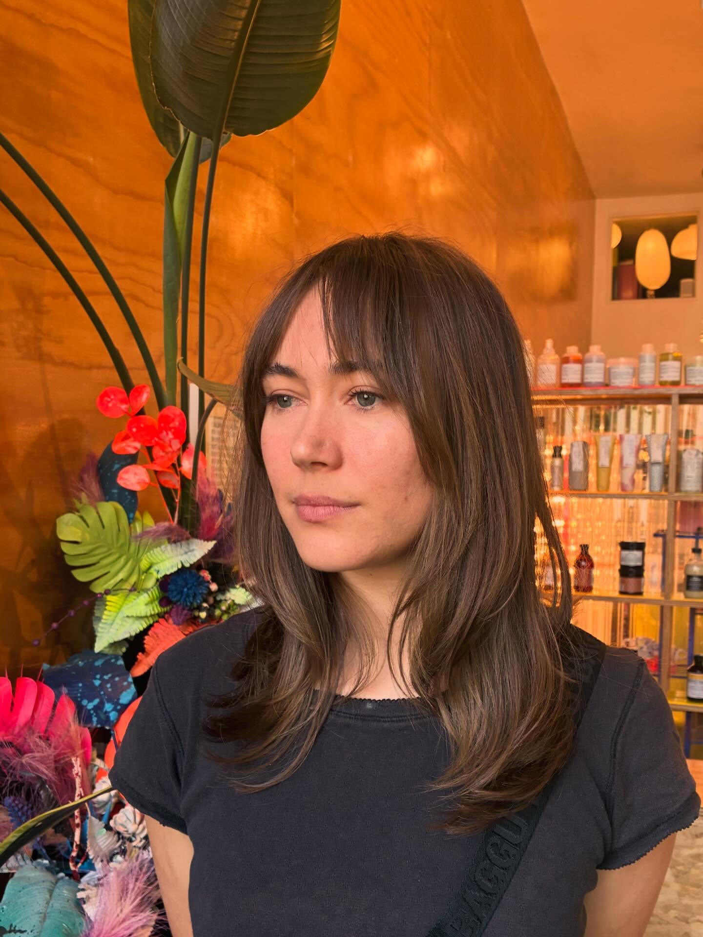 Breathy Brown Mid-Length Layers with Wispy Center-Separated Bangs
