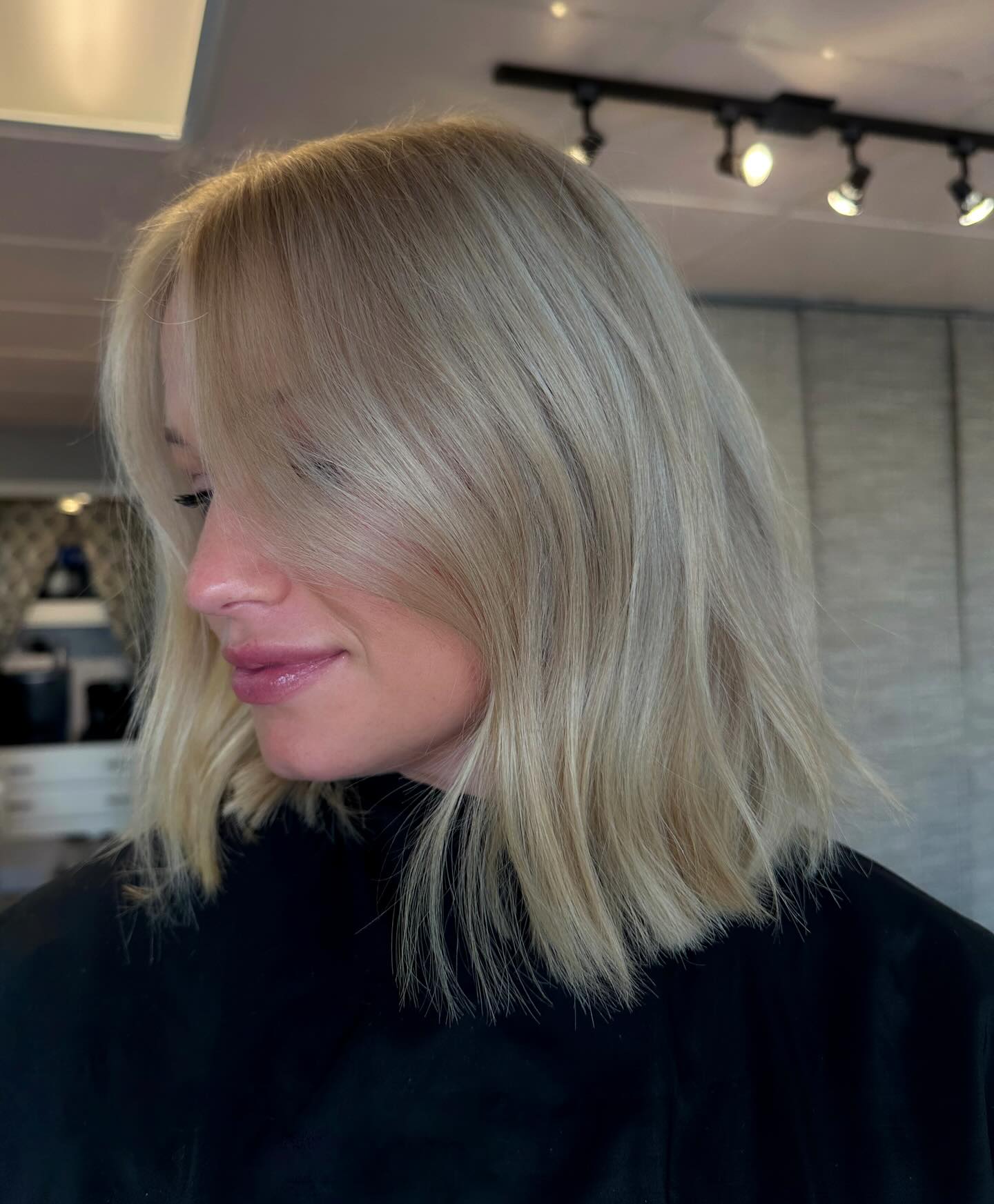 Cool Ash Blonde Mid-Lob with Feathered Face-Framing