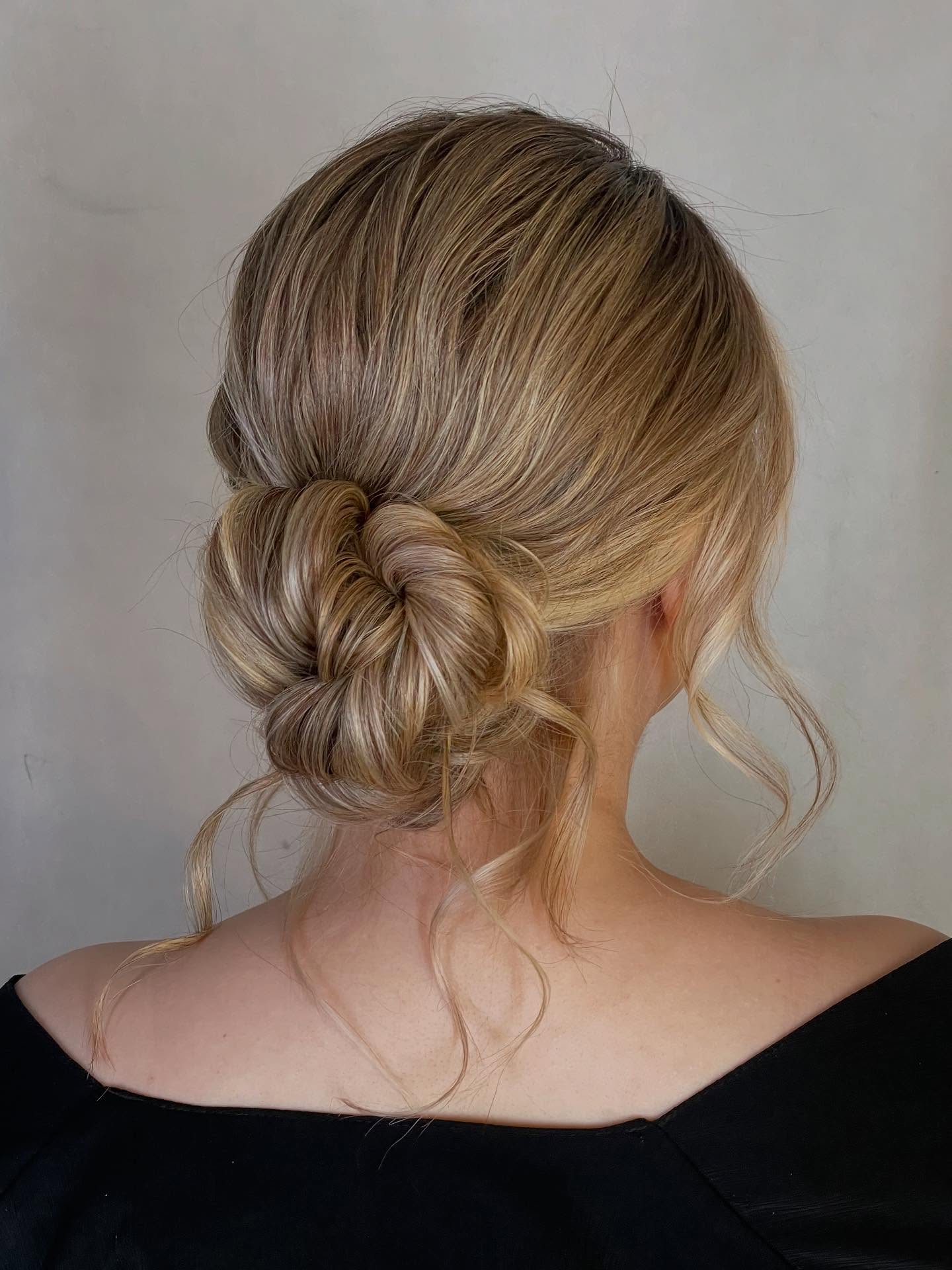 Delicate Twisted Low Knot with Soft Face‑Framing Tresses