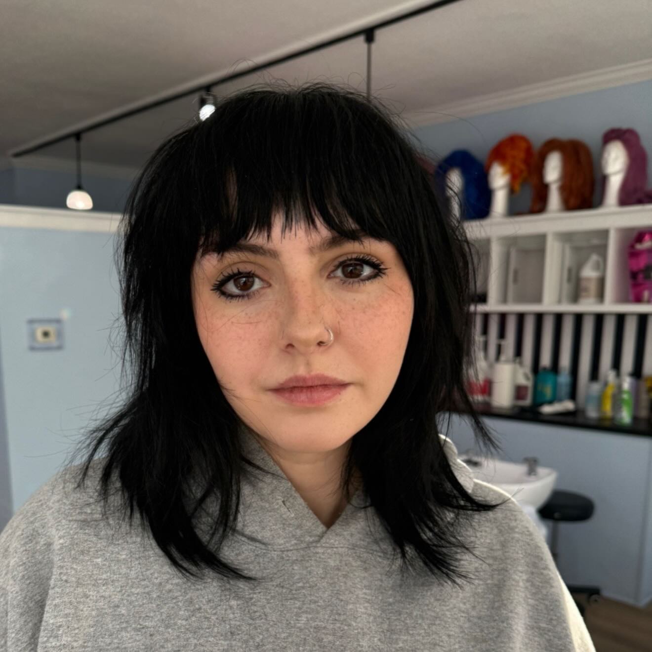 Edgy Black Shag with Short Blunt Fringe and Feathered Ends
