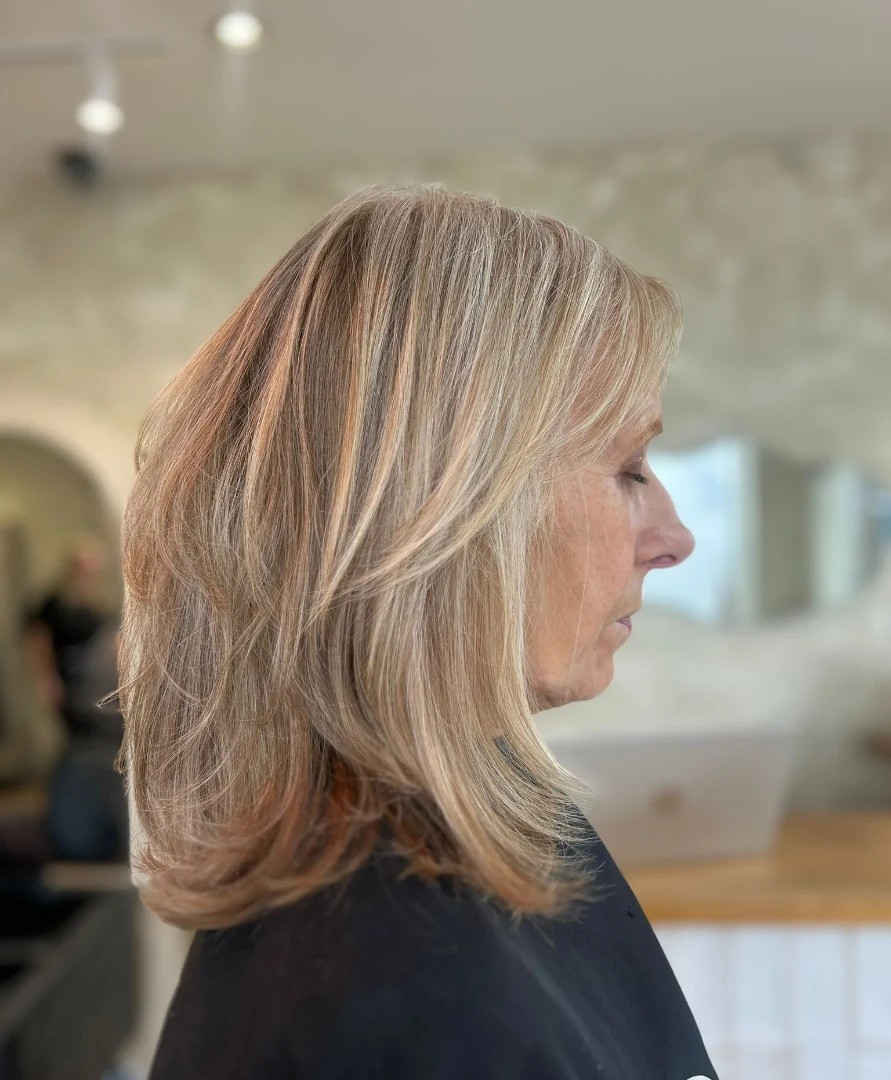 Feathered Mid-Length Layers with Subtle Pearl Balayage