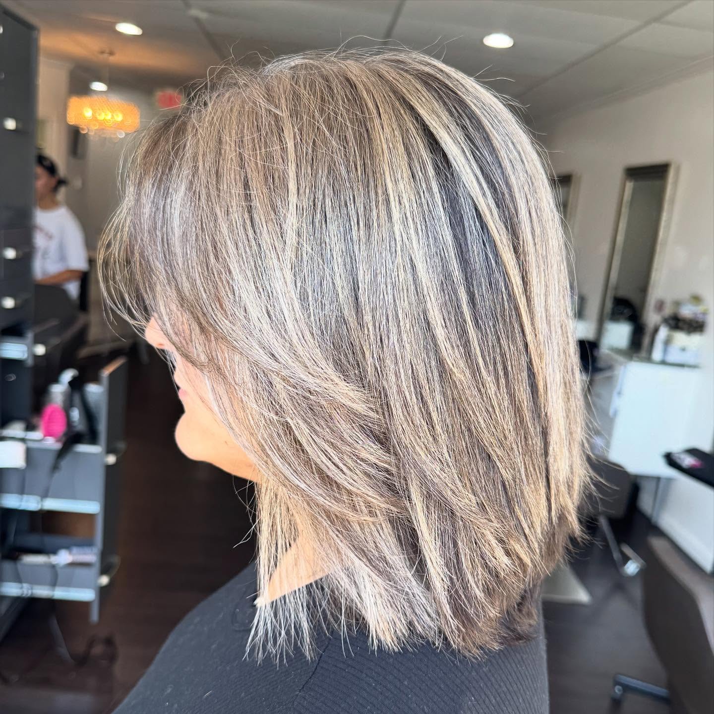 Feathered Shoulder-Length Grey-Blended Lob with Bright Face Frame