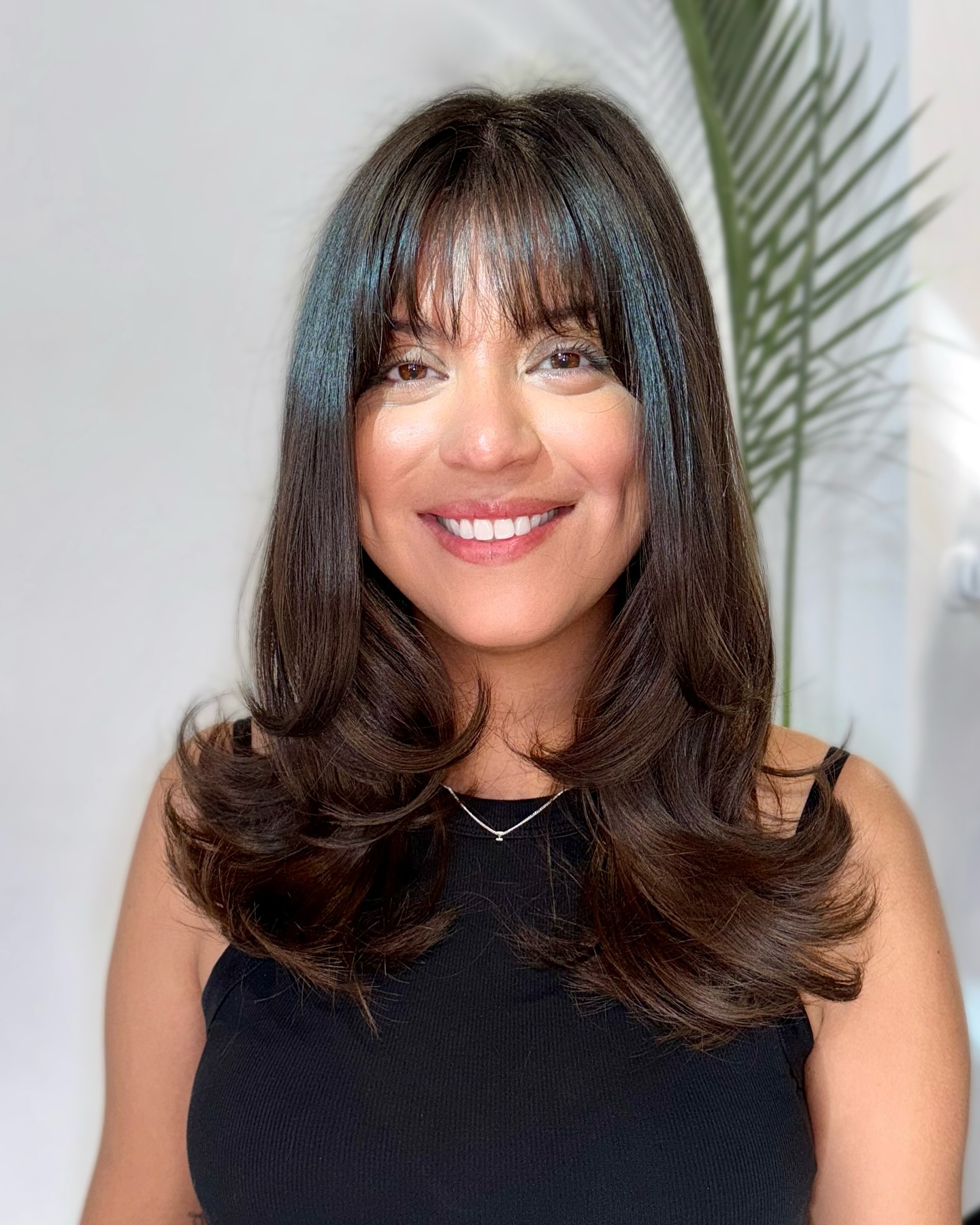 Glossy Layered Medium-Length Cut with Feathered Fringe