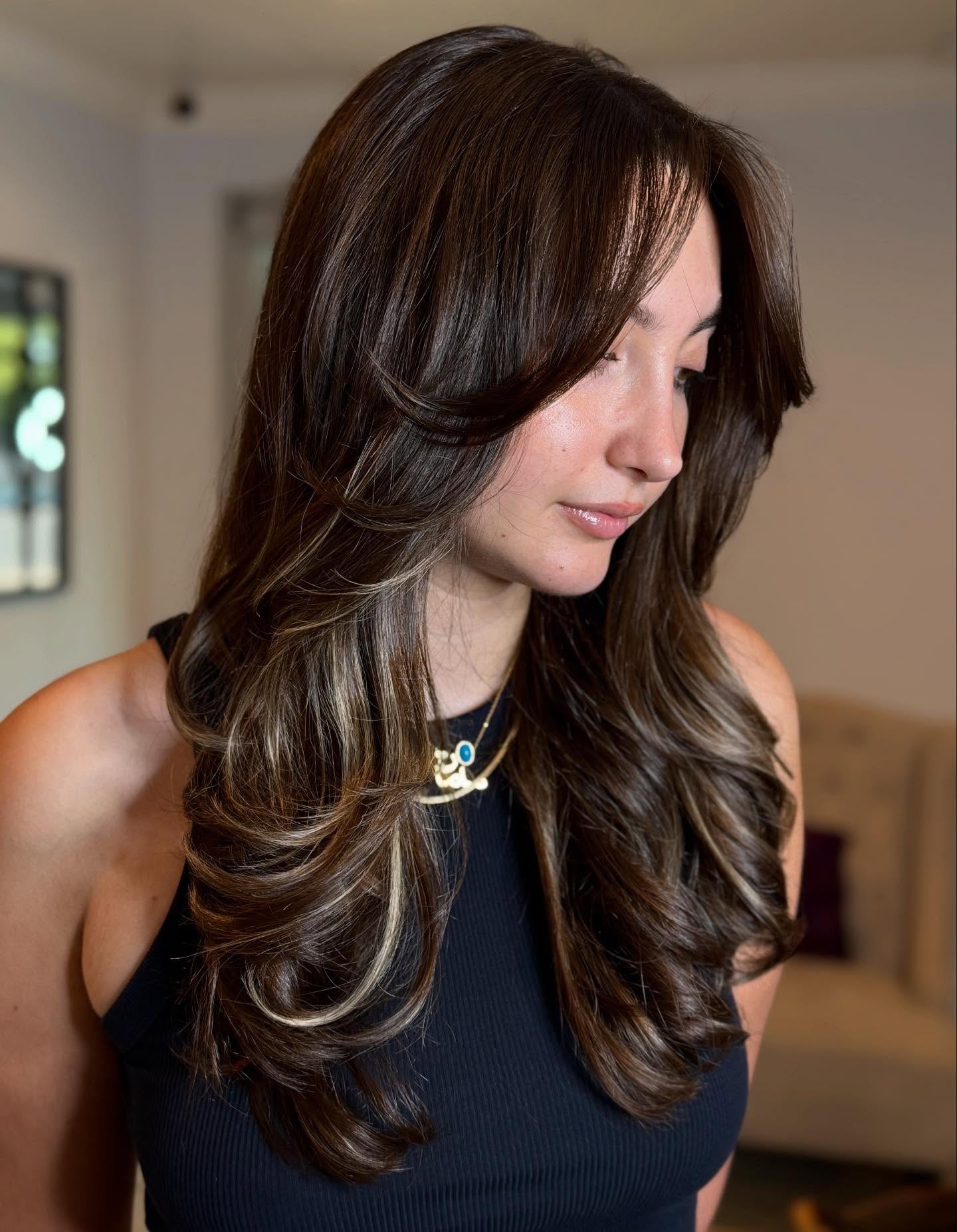 Long Feathered Face-Framing Layers with Underlit Blonde Slice