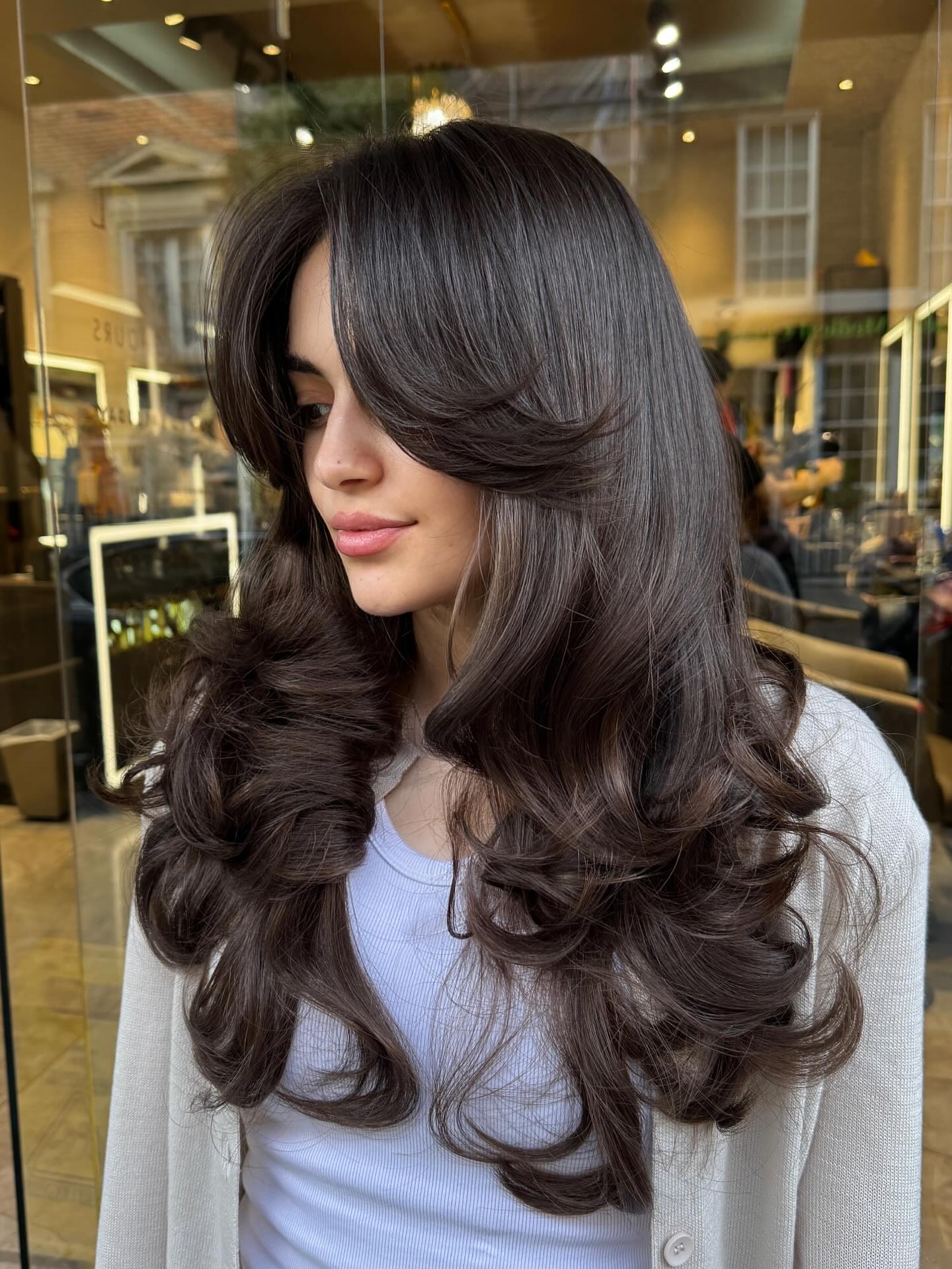 Luxe Dark Brunette Blown-Out Long Layers with S-Curl Ends