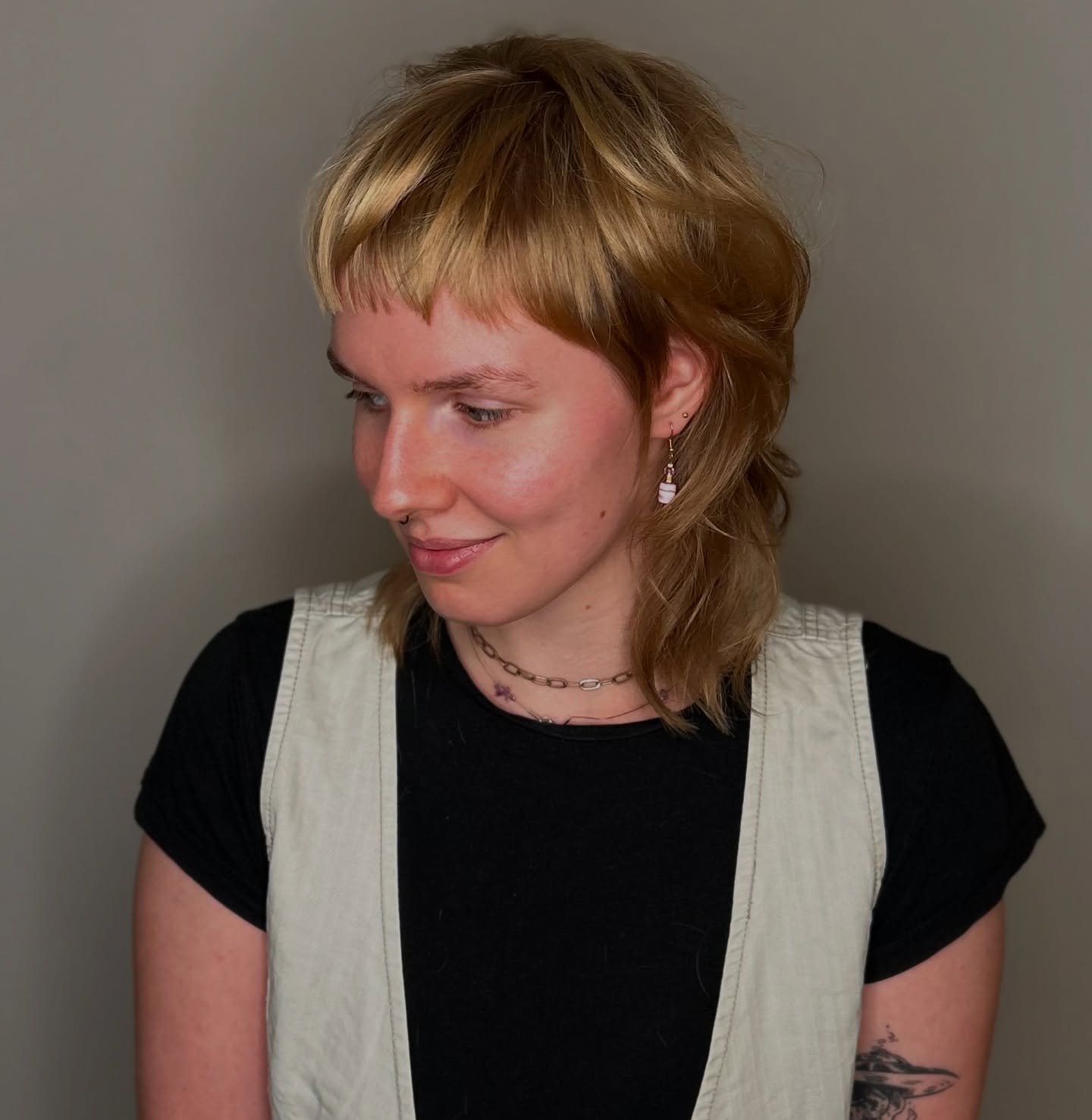 Modern Mullet with Choppy Micro Bangs and Feathered Crown