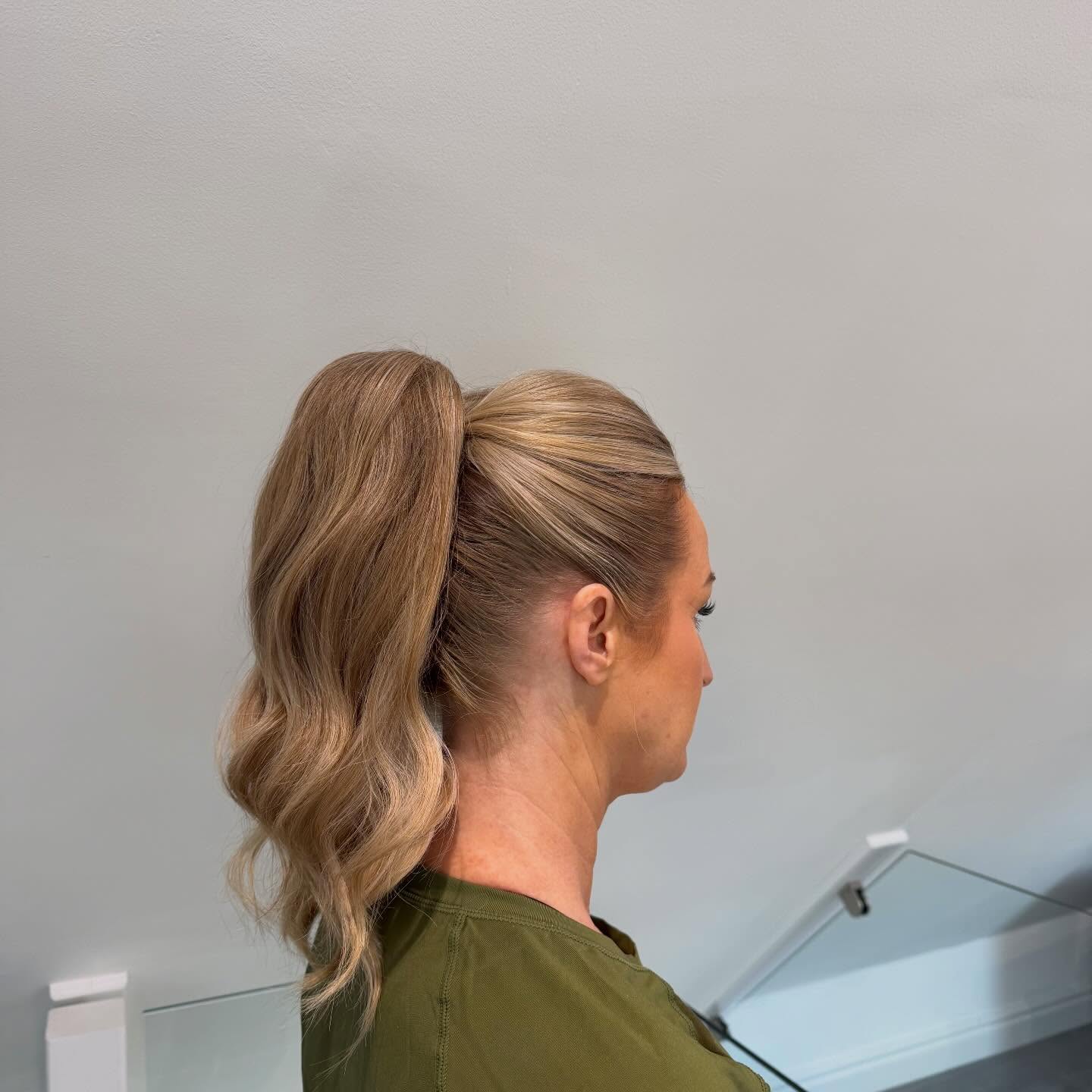 Polished High Ponytail with Wrapped Base and S-Shaped Waves
