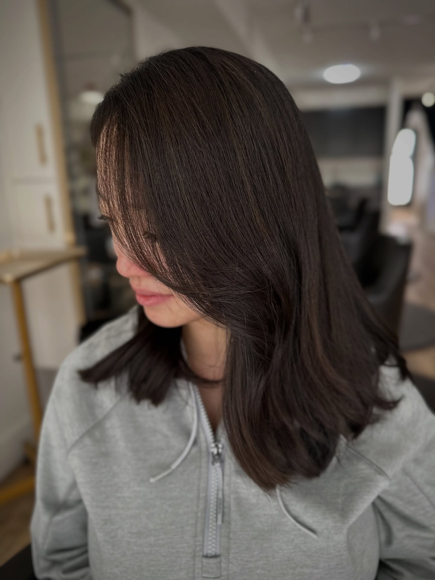 Shoulder-Grazing Mid-Length with Long Face-Framing Layers and Sweeping Side Fringe