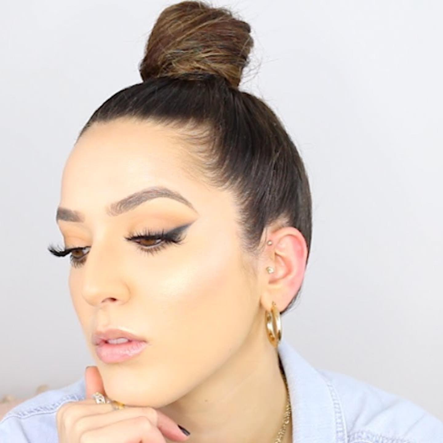 Sleek High Wrapped Topknot with Subtle End-Focused Balayage