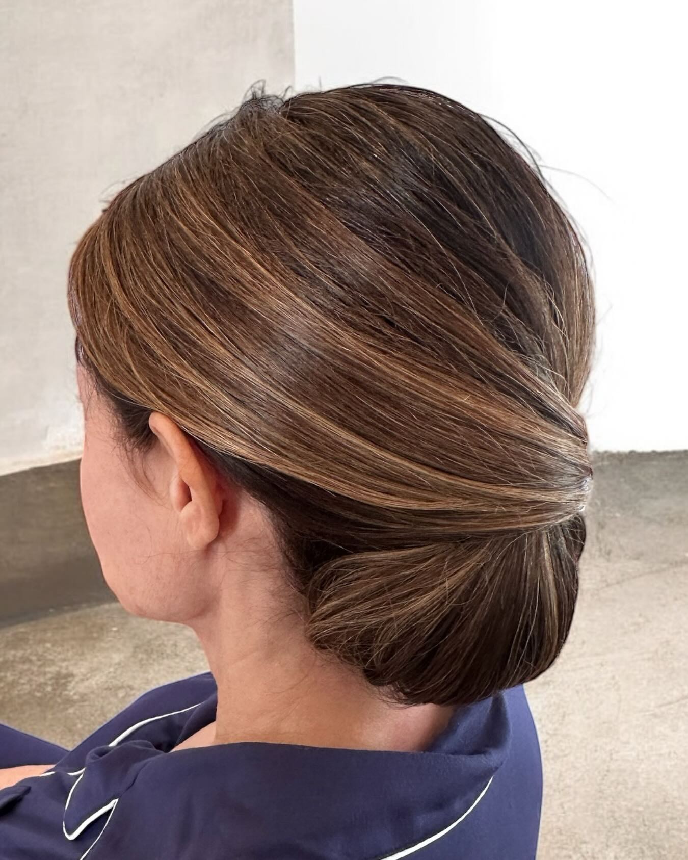 Sleek Low Tuck Chignon with Caramel Babylights