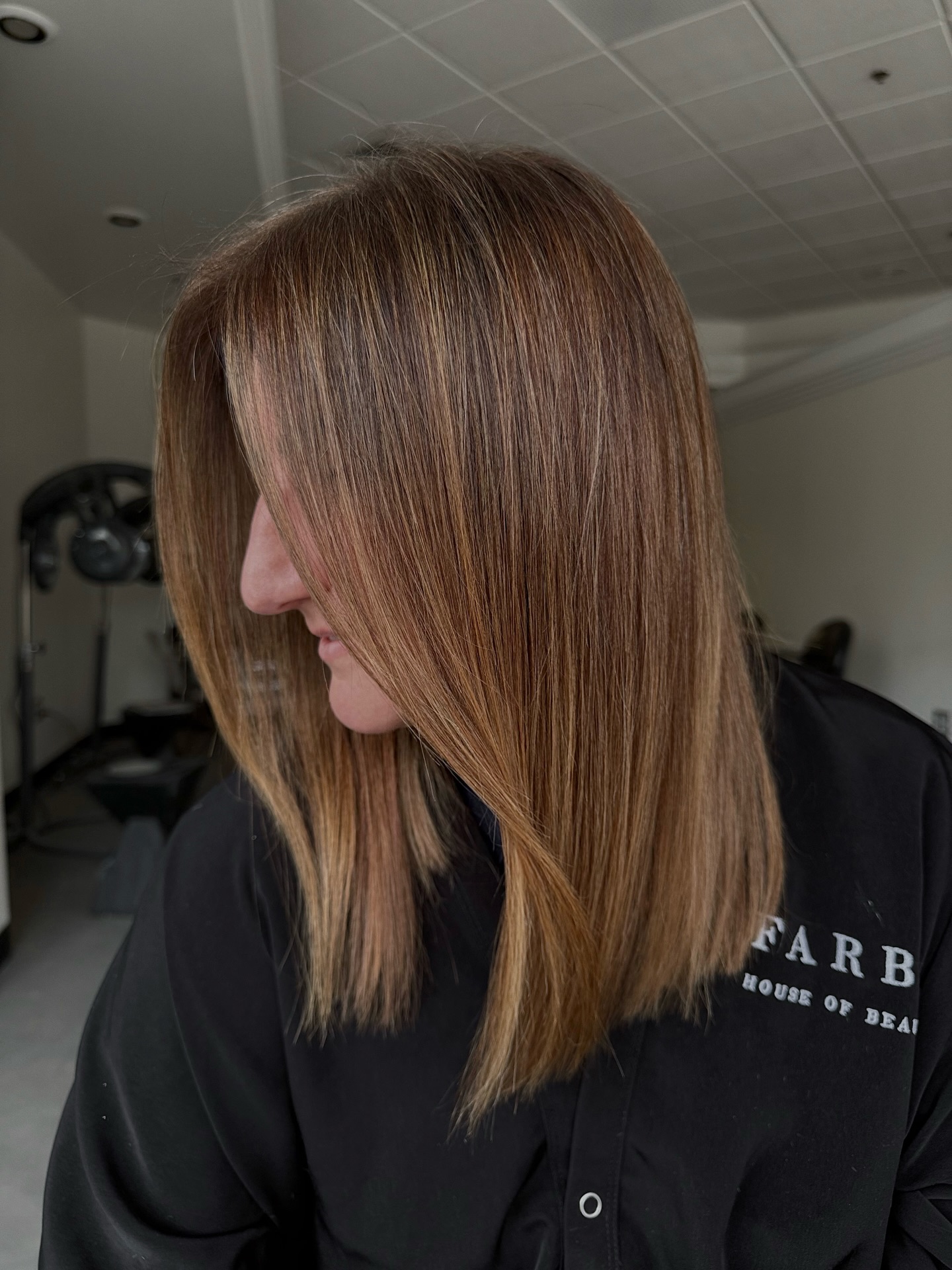 Smooth Chestnut Lob with Subtle Salt-and-Pepper Face-Framing