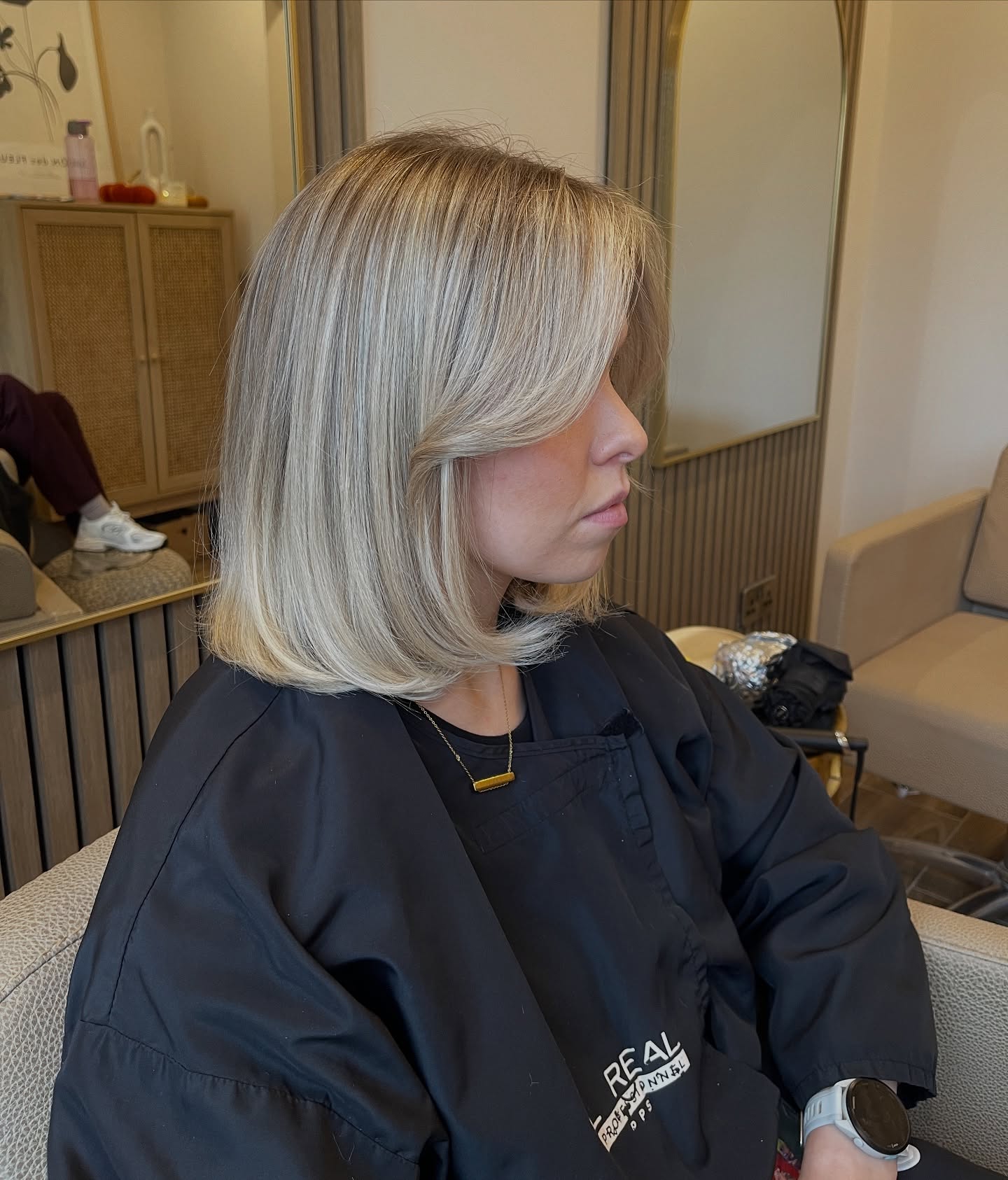 Soft Curved Ash-Blonde Long Bob with Built-In Round-Brush Roll