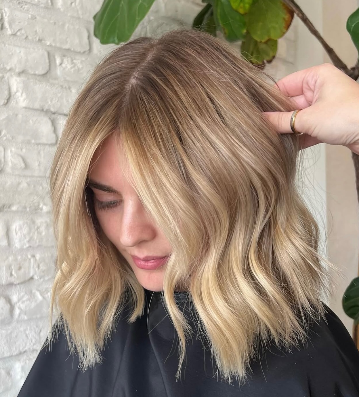 Warm-Rooted Champagne Blonde Mid-Lob with Point-Textured Ends