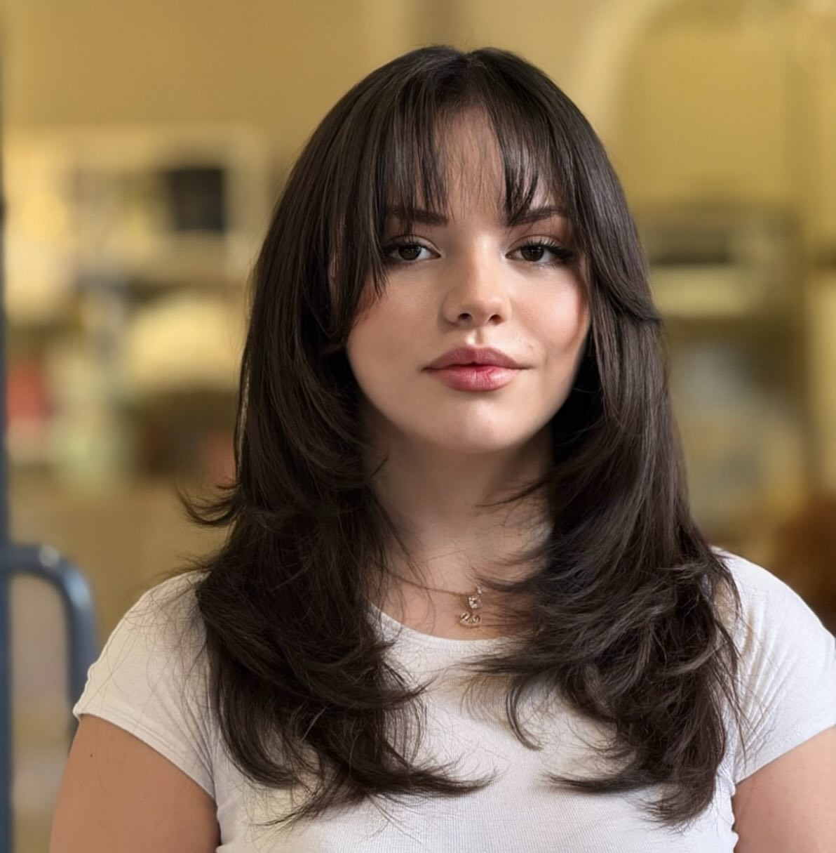 Feathered Mid-Length Cut with Wispy Curtain Fringe