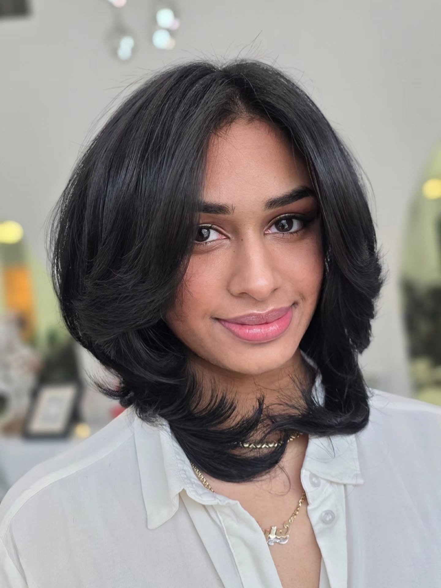 Feathered Shoulder-Length Blowout with Curtain Layers