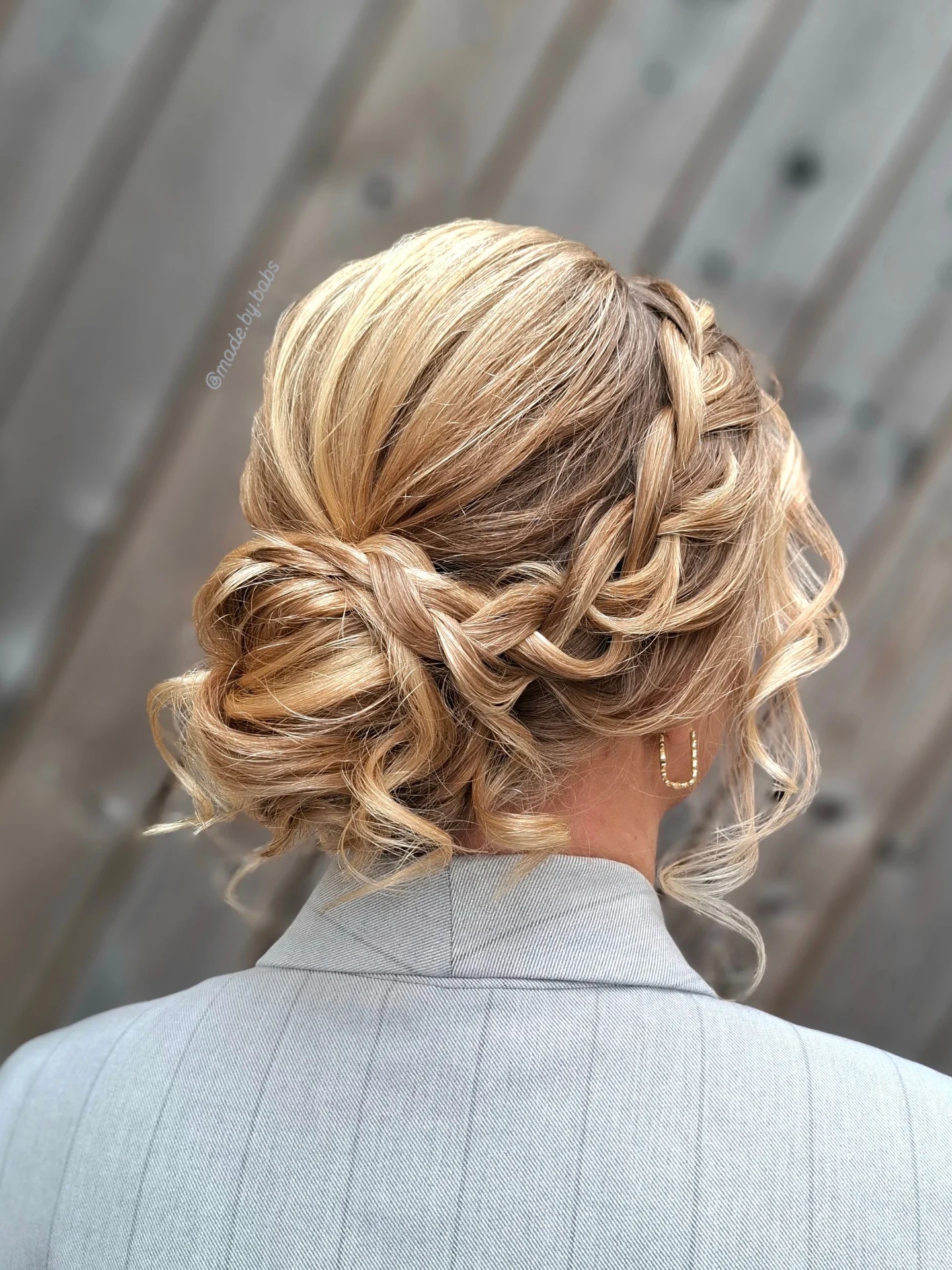 Sunlit Braided Low Bun with Subtle Root Shadow