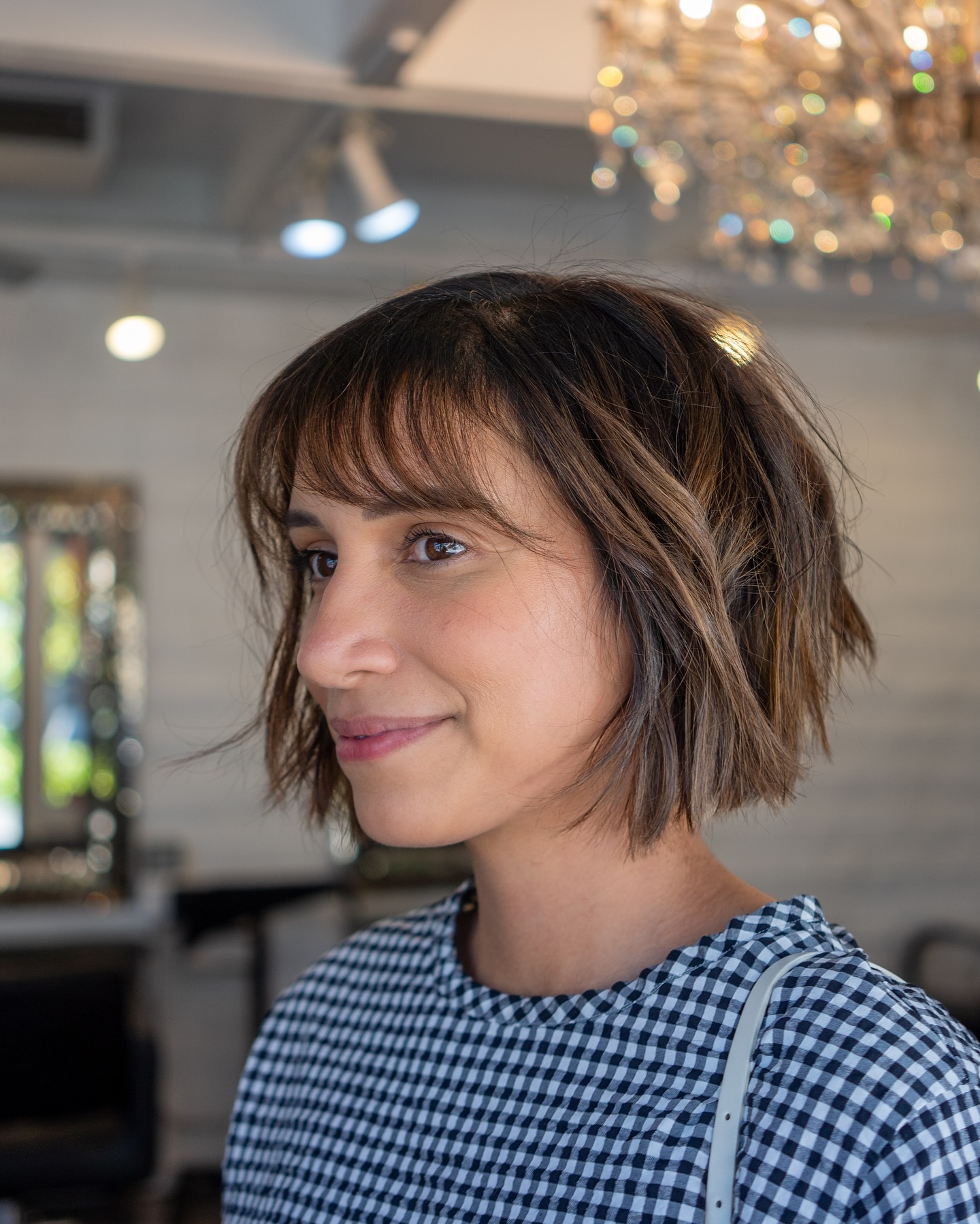 Choppy Textured Jaw-Length Bob with Wispy Fringe and Caramel Babylights