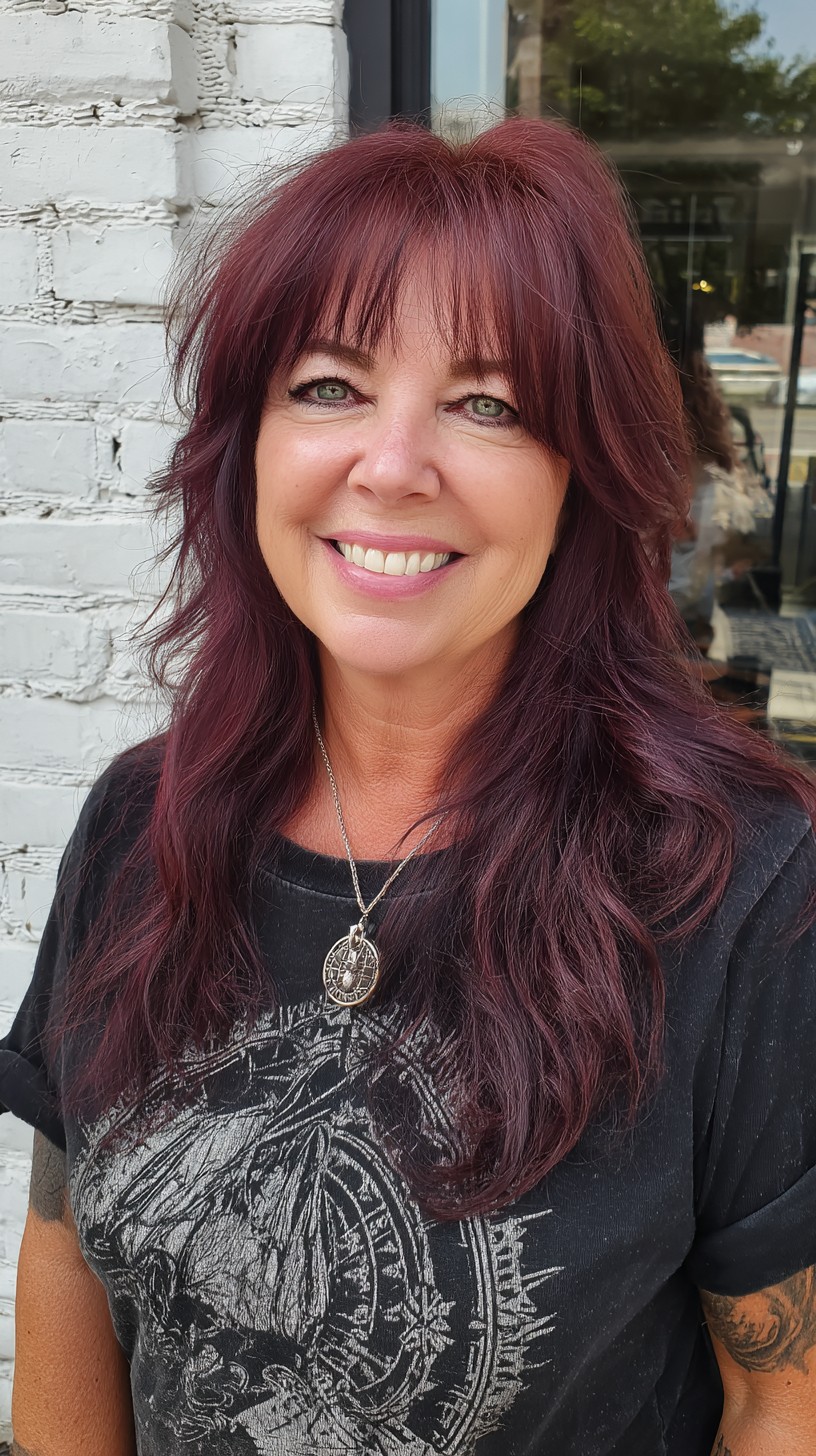 Long Feathered Maroon Wolf Cut with Soft Brow-Framing Fringe