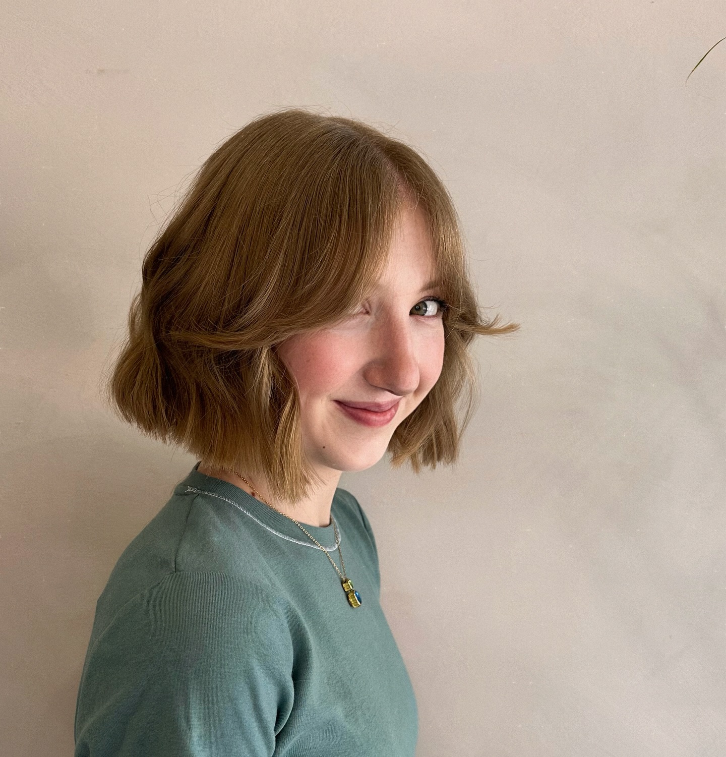 Soft Chin-Length Bob with Flipped Ends and Curtain Face-Framing