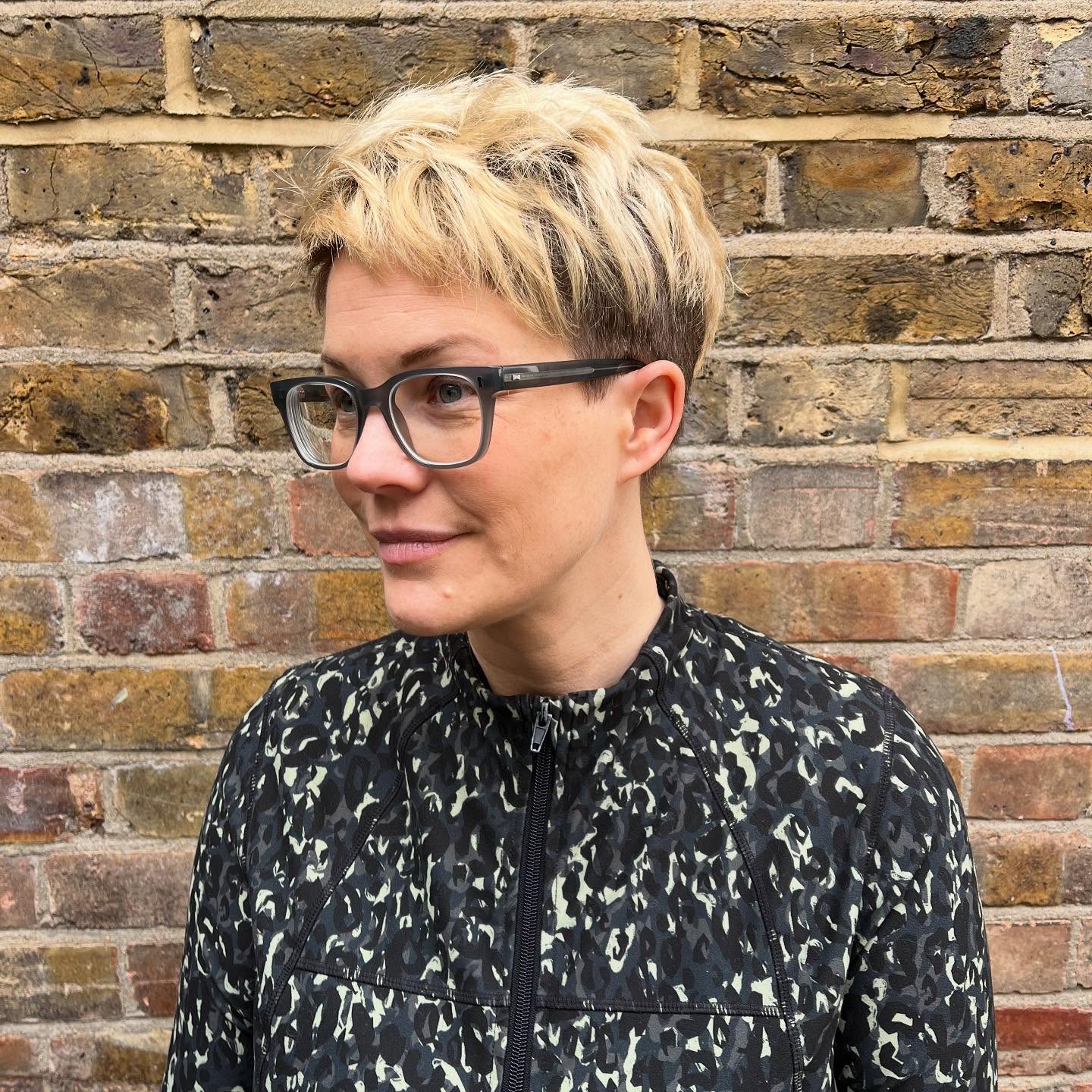 Textured Blonde Pixie with Dark Root Contrast