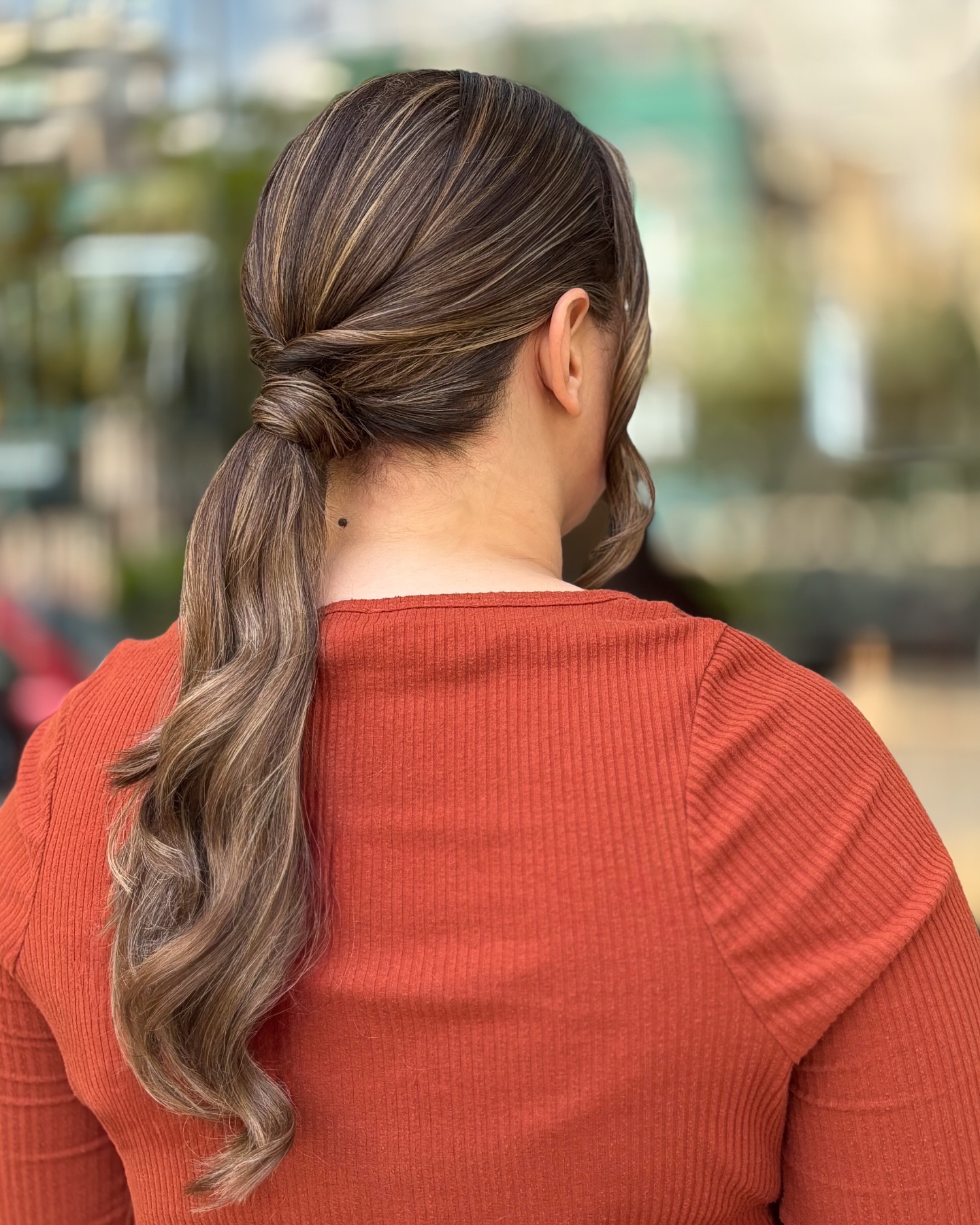 Low Wrapped Knot Ponytail with Warm Brunette Balayage