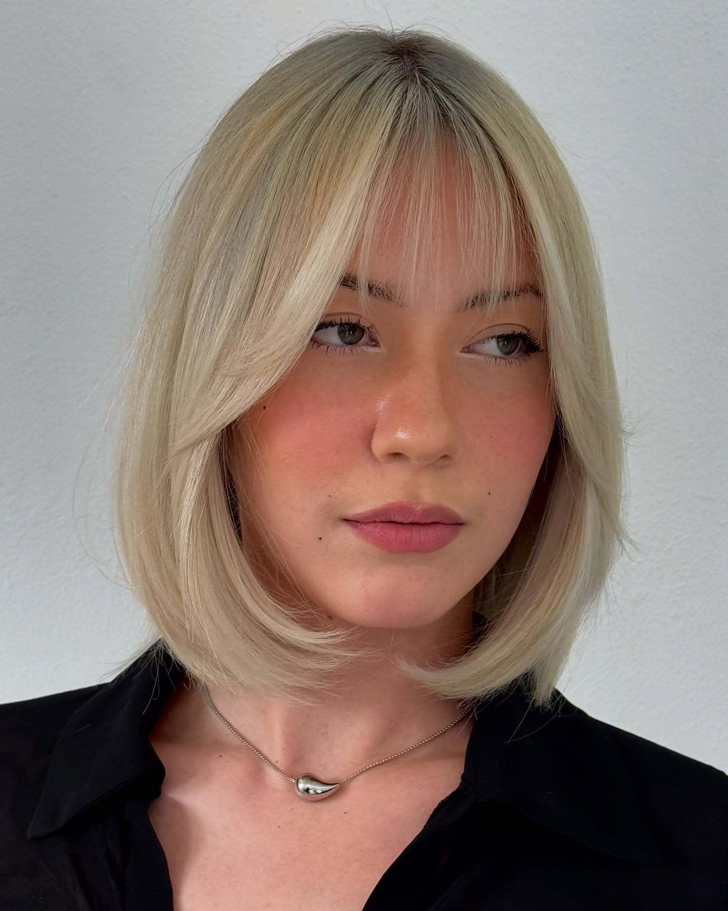 Platinum Blunt Lob with Soft Micro-Bangs and Interior Graduation