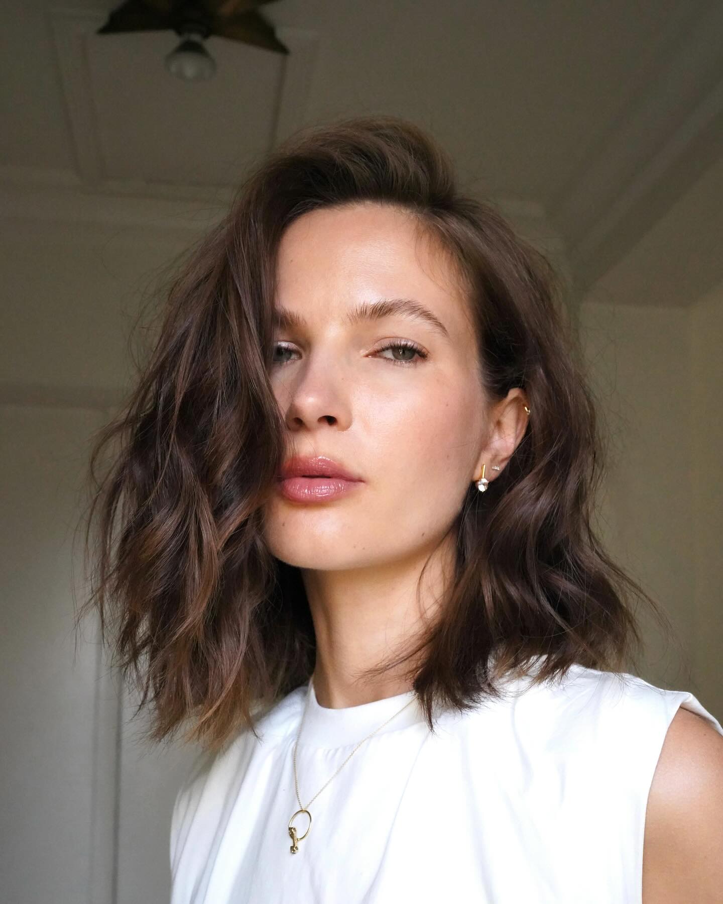 Tousled Collarbone Lob with Deep Side-Swept Root Lift