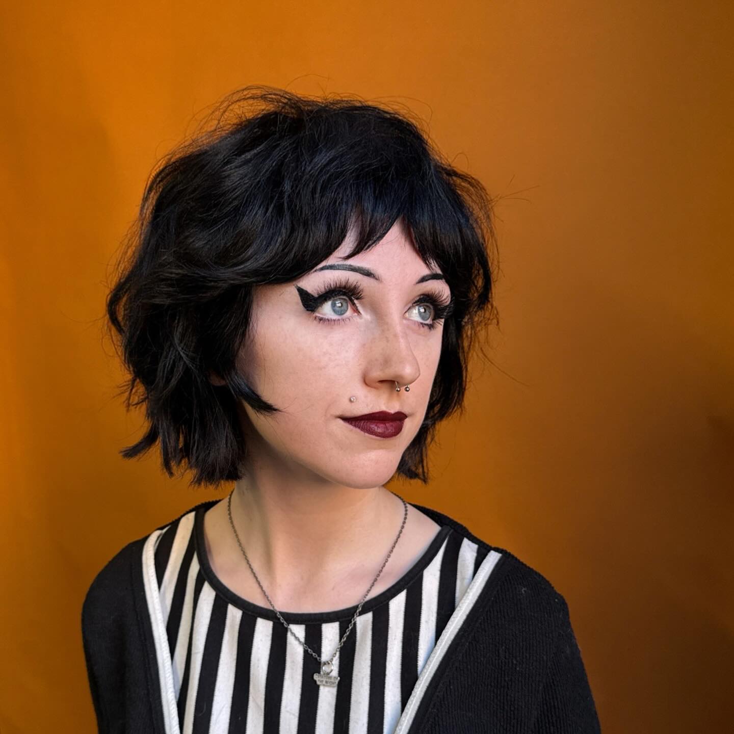 Edgy Choppy Black Shag Bob with Cropped Wispy Fringe