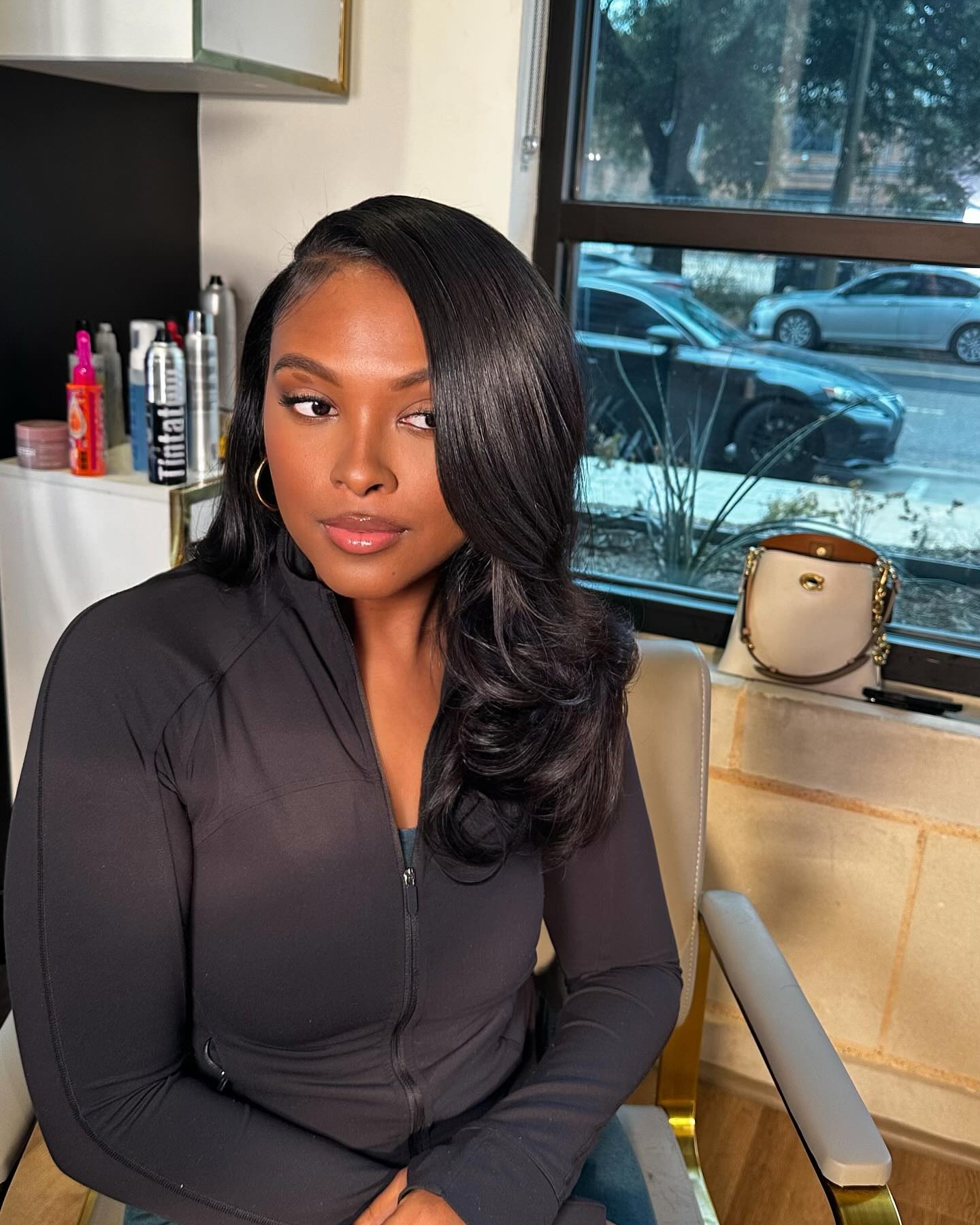 Sleek Deep Side-Parted Blowout with Curved Face-Framing Layers