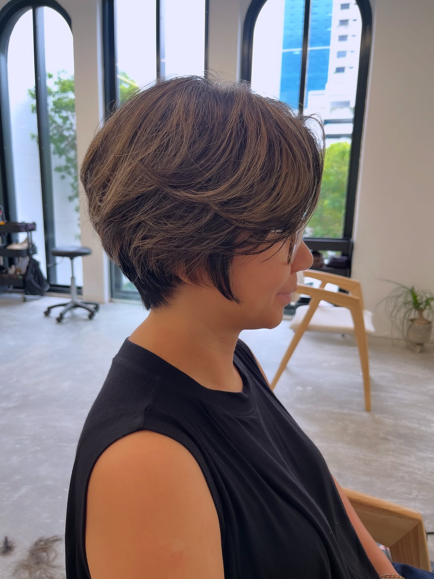 Ash-Brown Short Stacked Bob with Side-Swept Face-Framing Layers