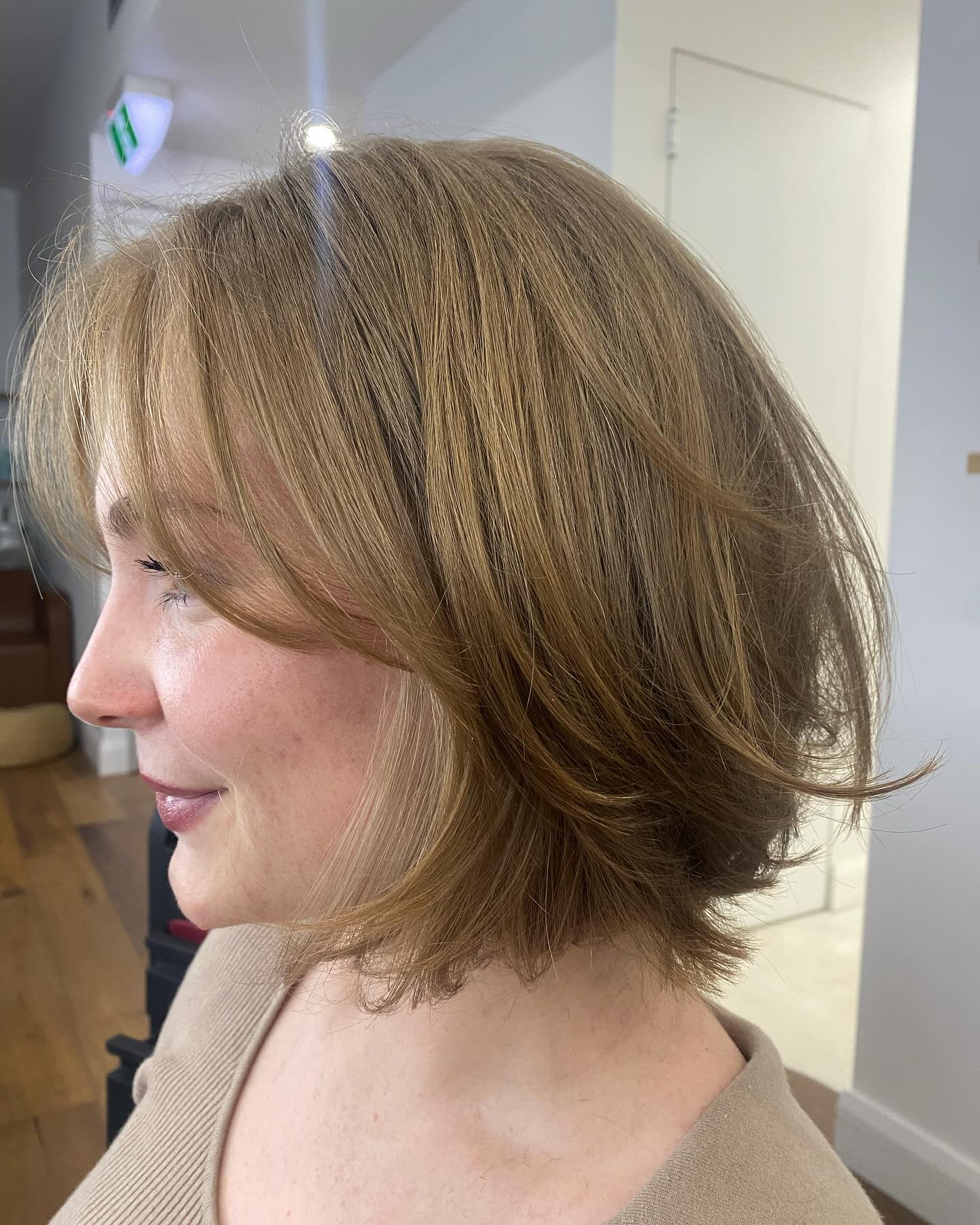 Caramel Chin-Length Layered Bob with Soft Flicked Ends