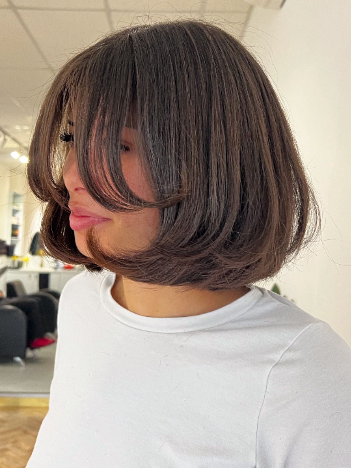 Chin-Length Rounded Bob with Long Sweeping Face-Framing Layers