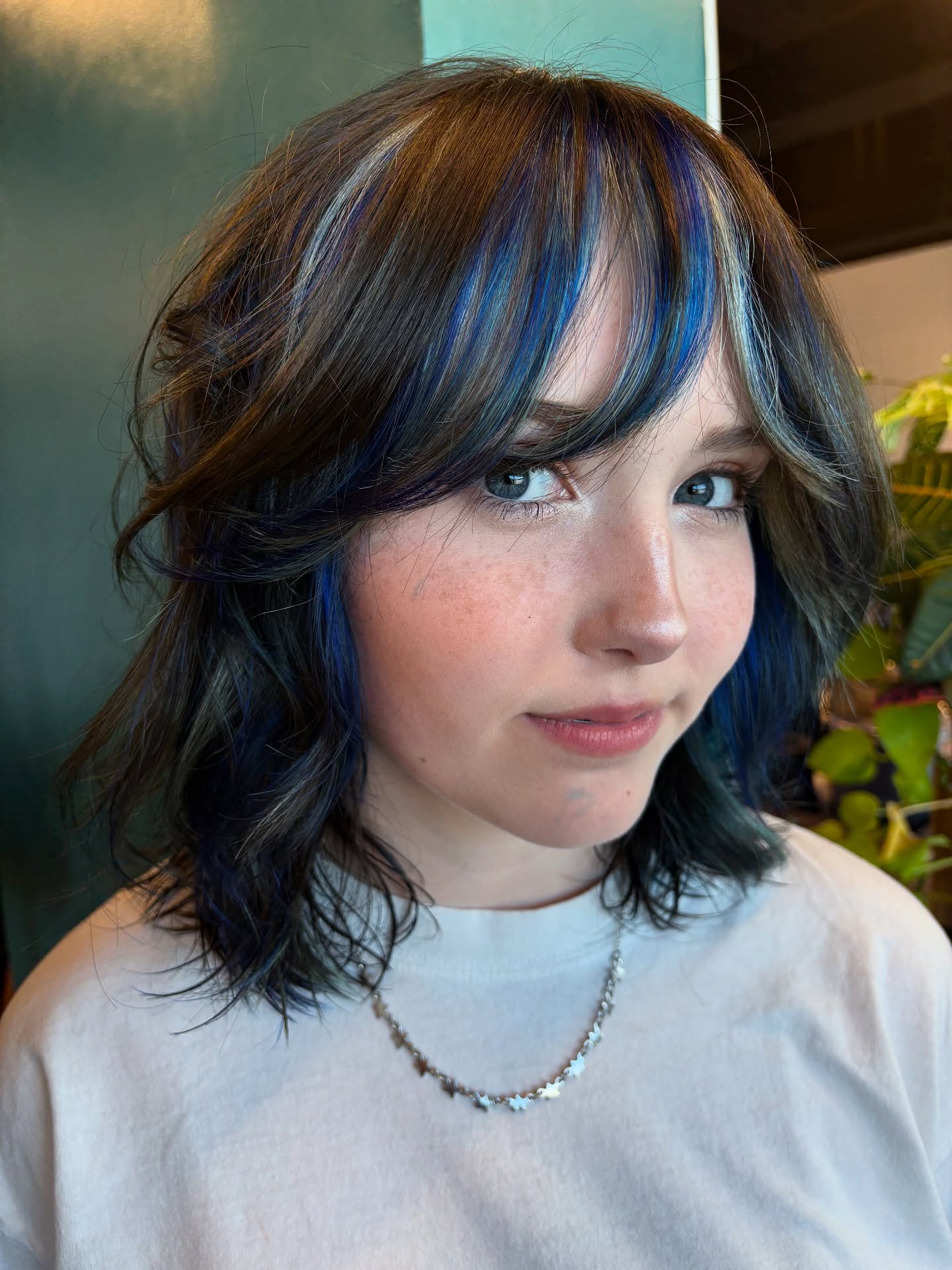 Medium-Length Layered Shag with Face-Framing Blue Peekaboo Highlights