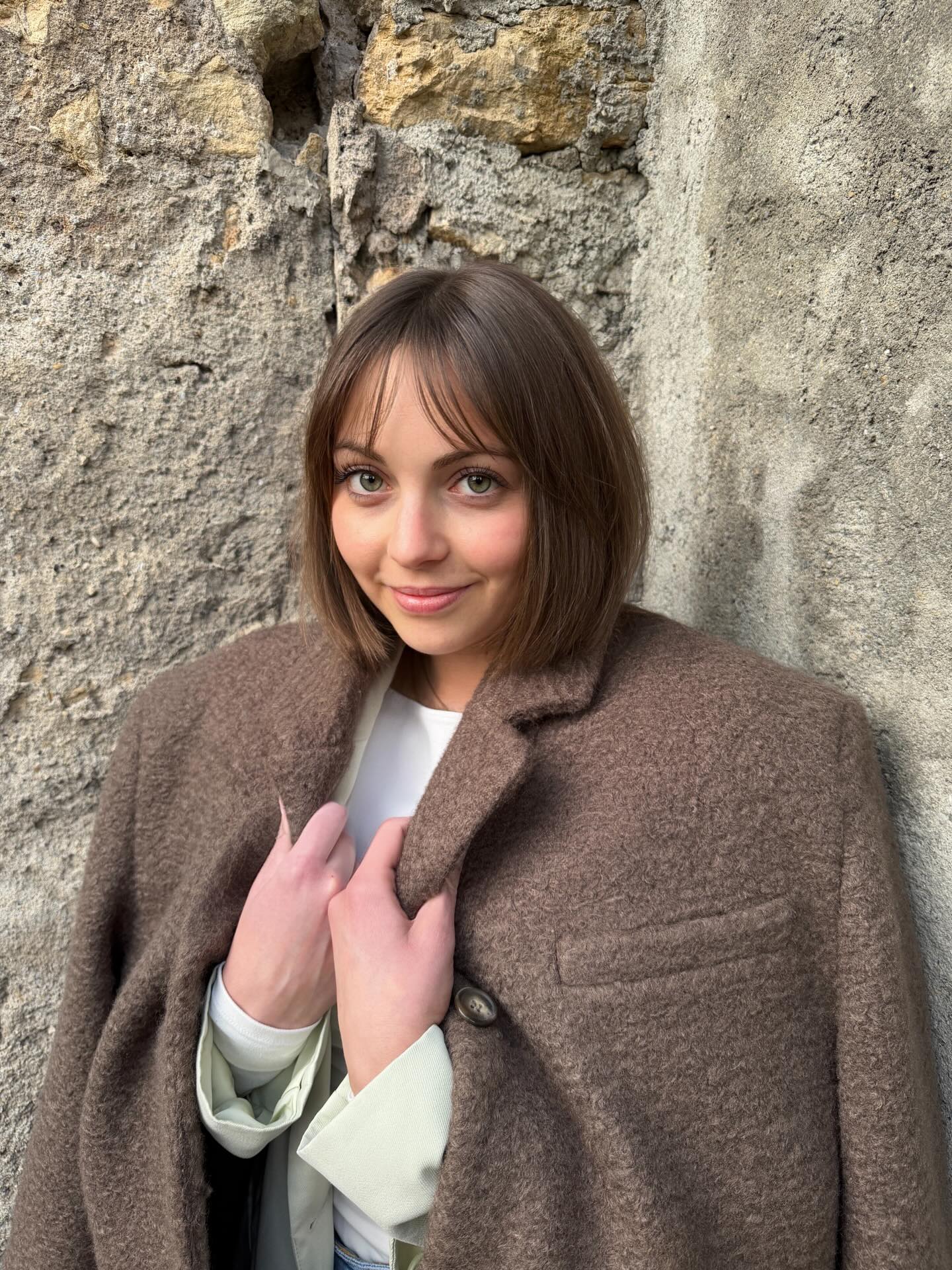Neutral Ash-Brown Chin-Grazing Bob with Sheer Center-Split Fringe