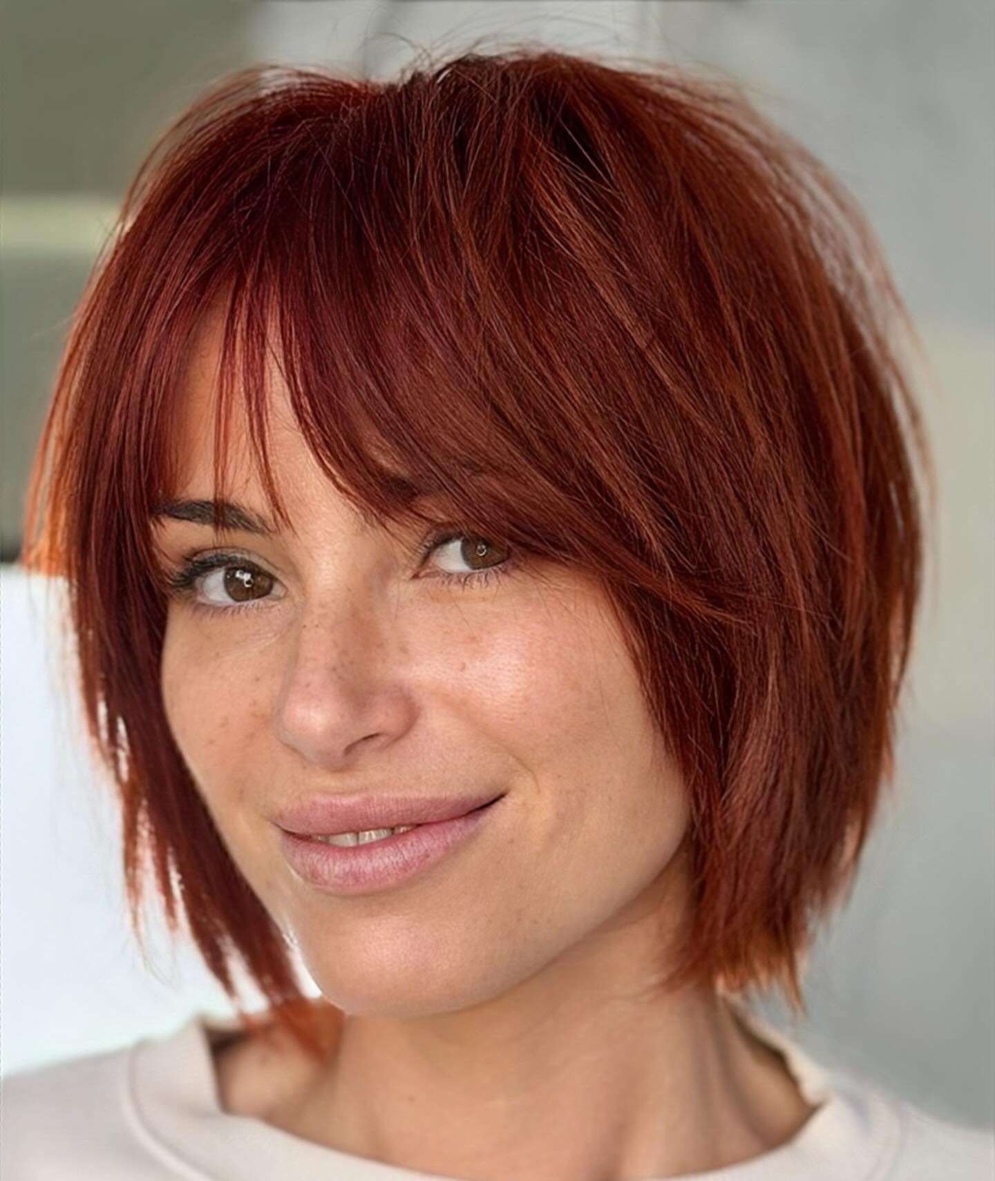 Razor-Textured Chin-Length Copper Bob with Wispy Bangs