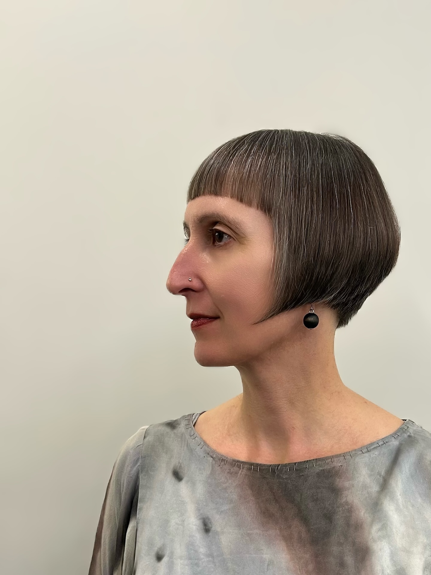 Rounded Cropped Bowl Bob with Blunt Micro Fringe and Silver Dimension