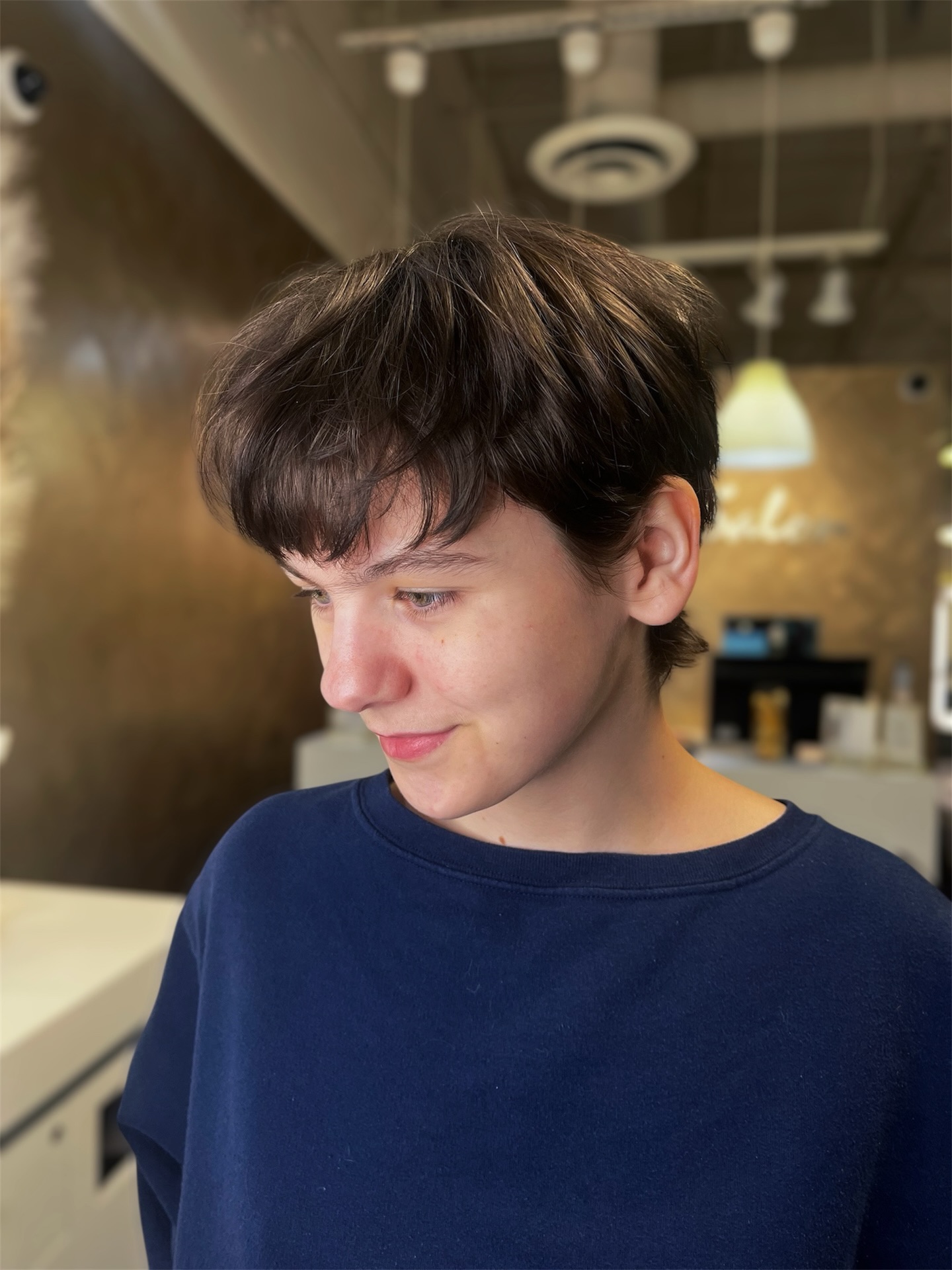 Short Layered Pixie with Rounded Curtain Bangs and Nape Taper