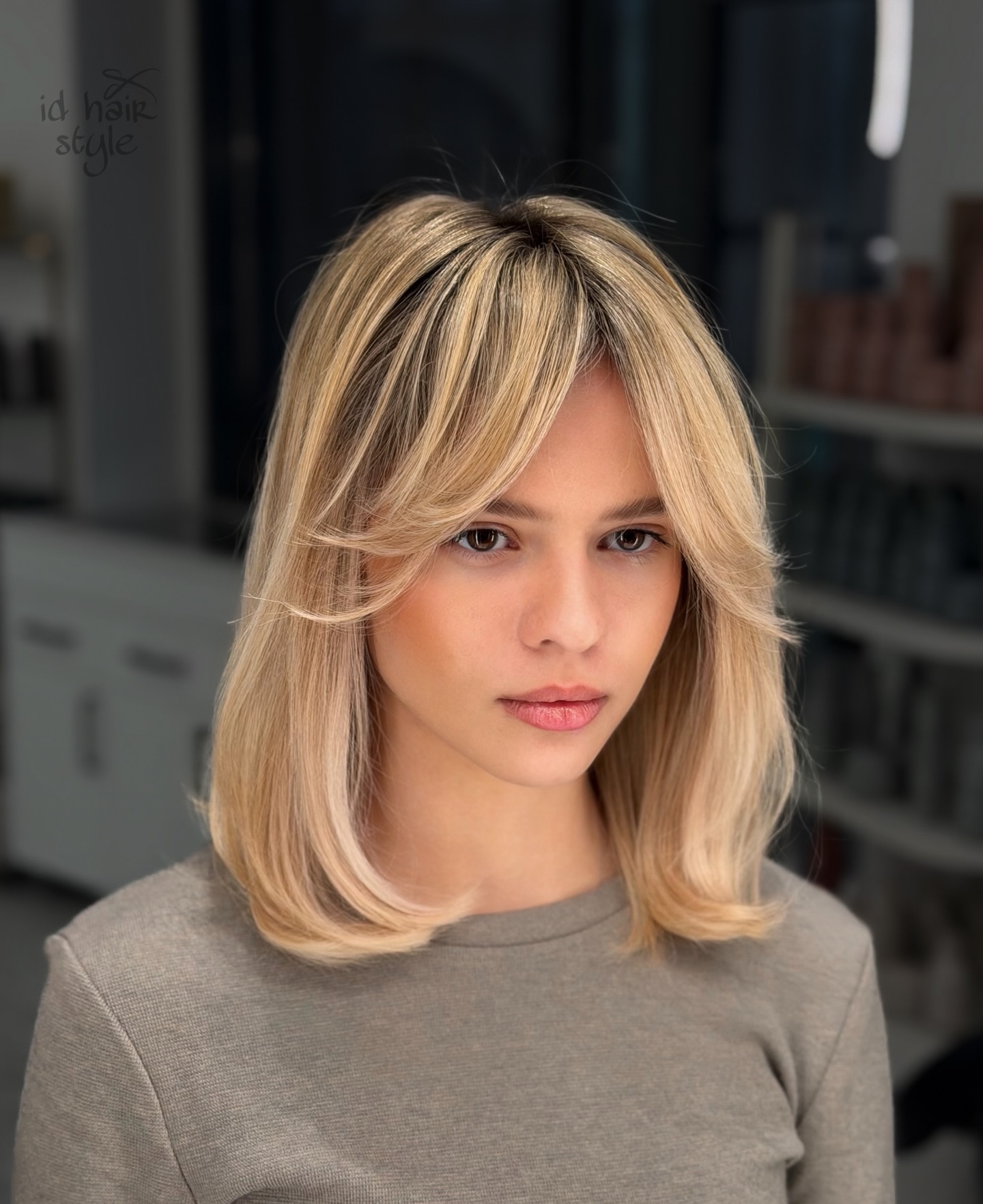 Shoulder-Length Blended Blonde Bob with Face-Framing Feathered Fringe