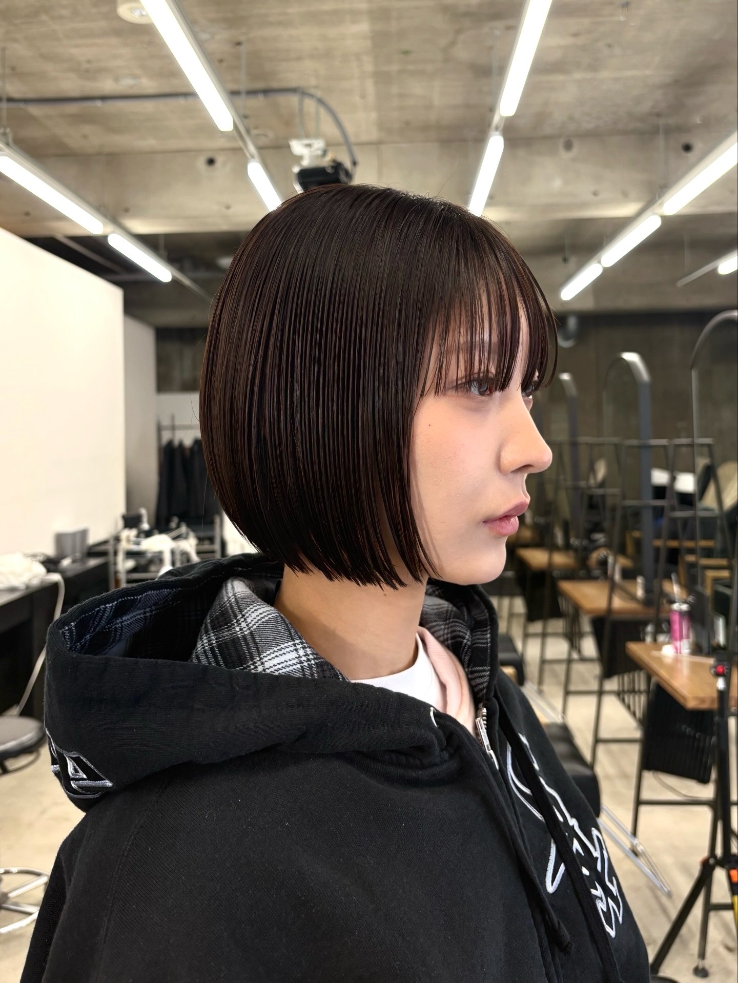 Sleek Chin-Grazing Espresso Bob with Sheer Vertical Fringe