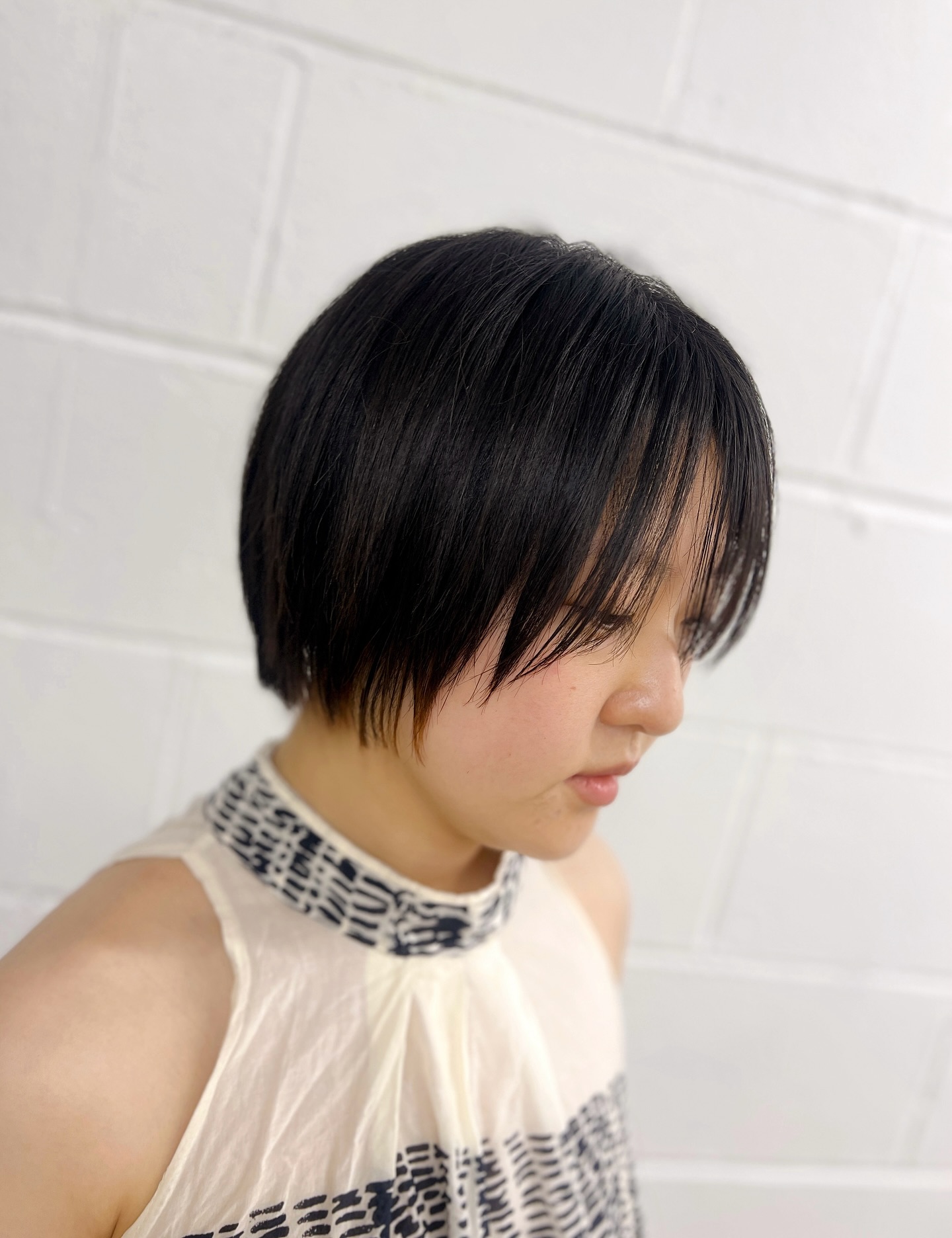 Sleek Chin-Length Layered Bob with Razor-Soft Curtain Fringe