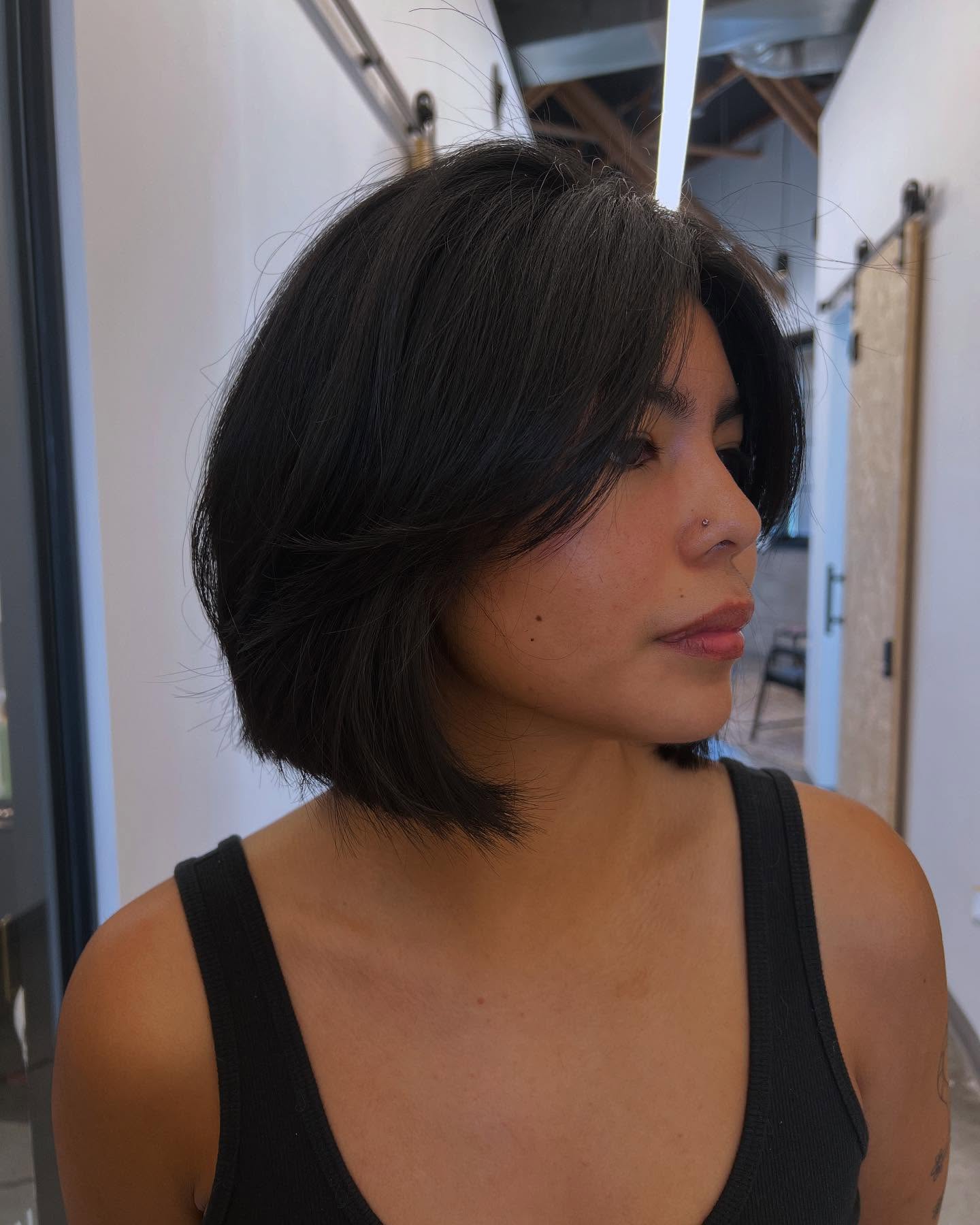 Textured Chin-Length Stacked Bob with Feathered Curtain Bangs