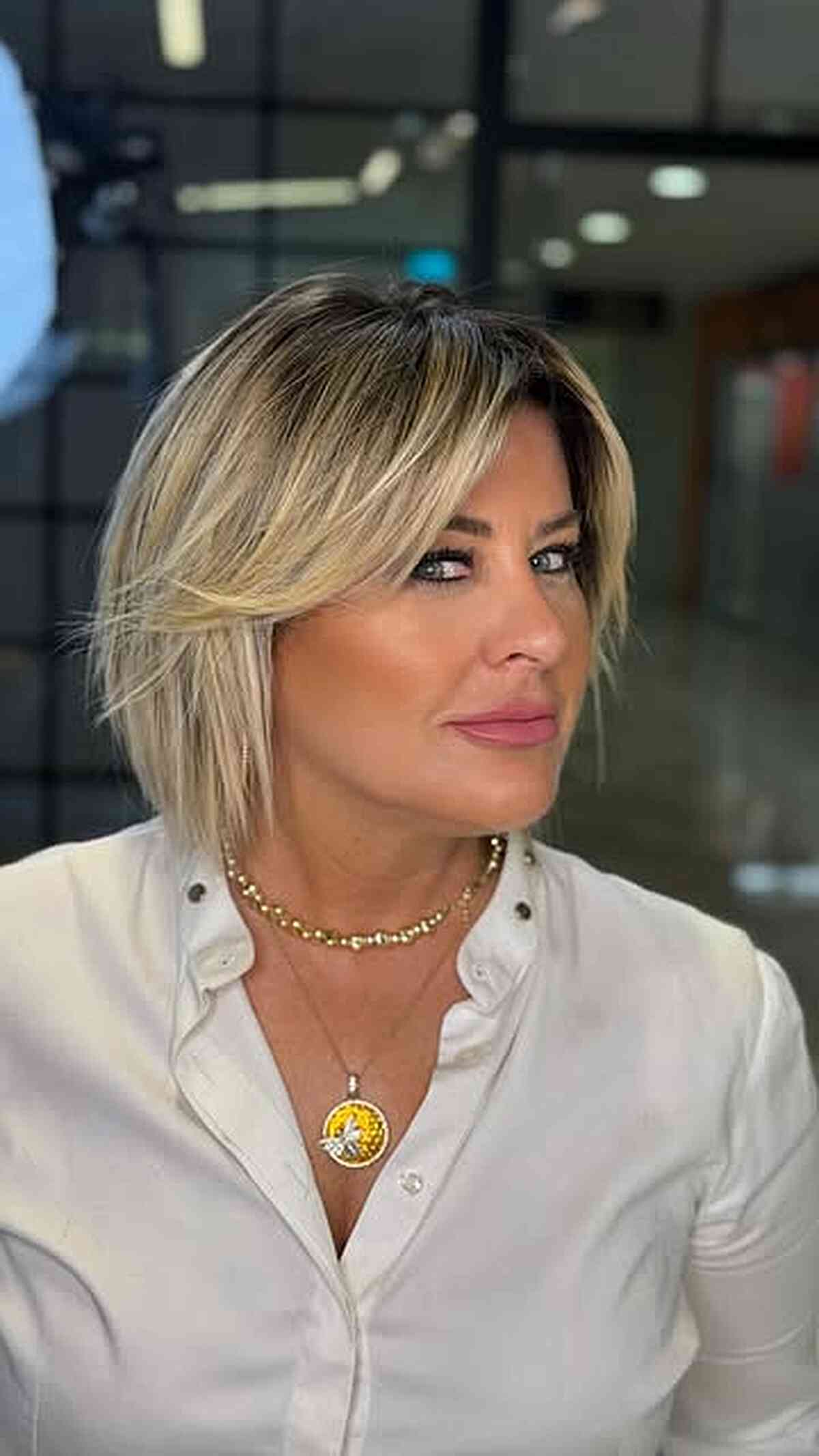 Buttery Blonde Layered Bob with Curtain Bangs